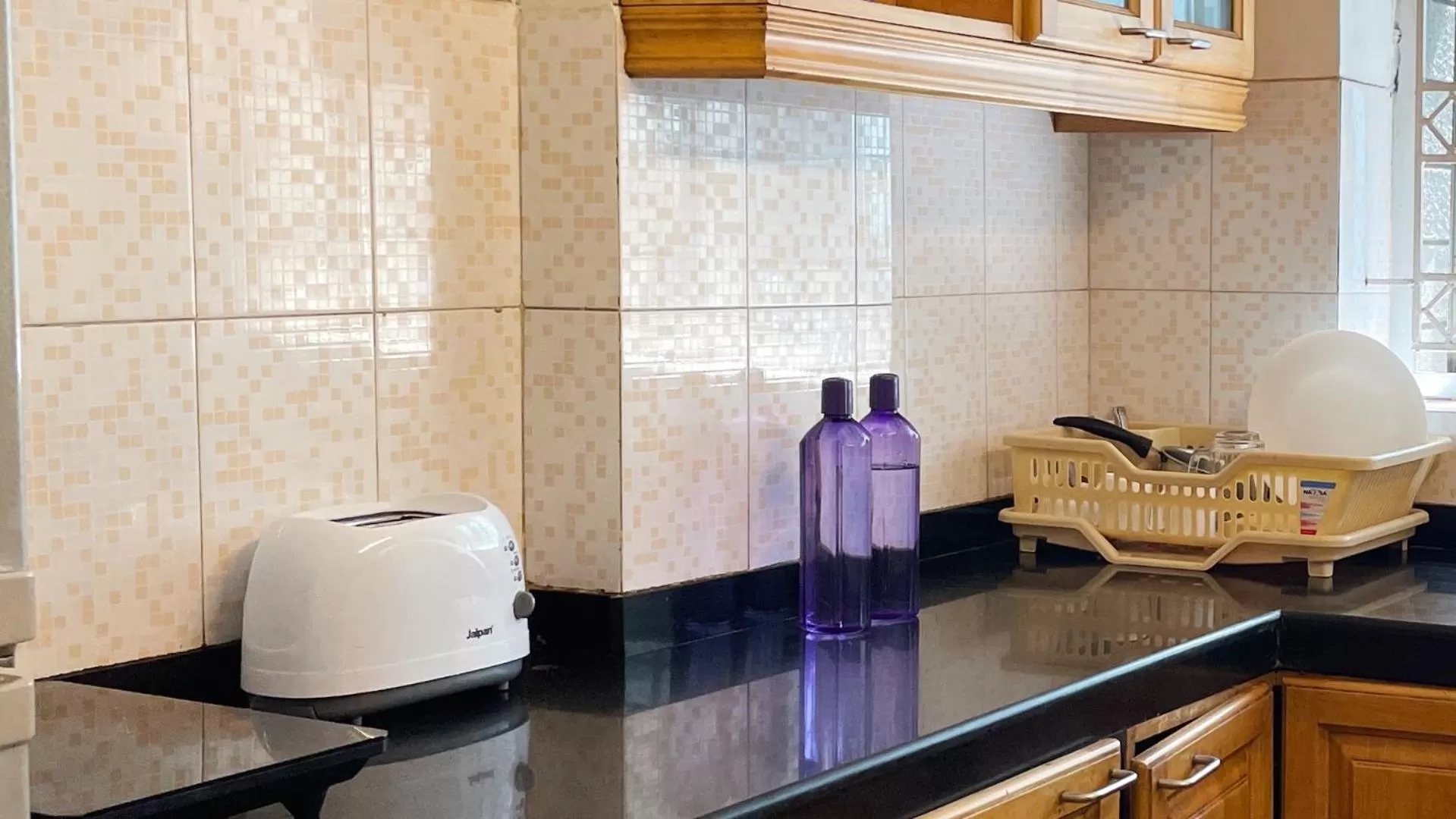 Kitchen or kitchenette in The Aster Homestay - Bedrooms & Apartments