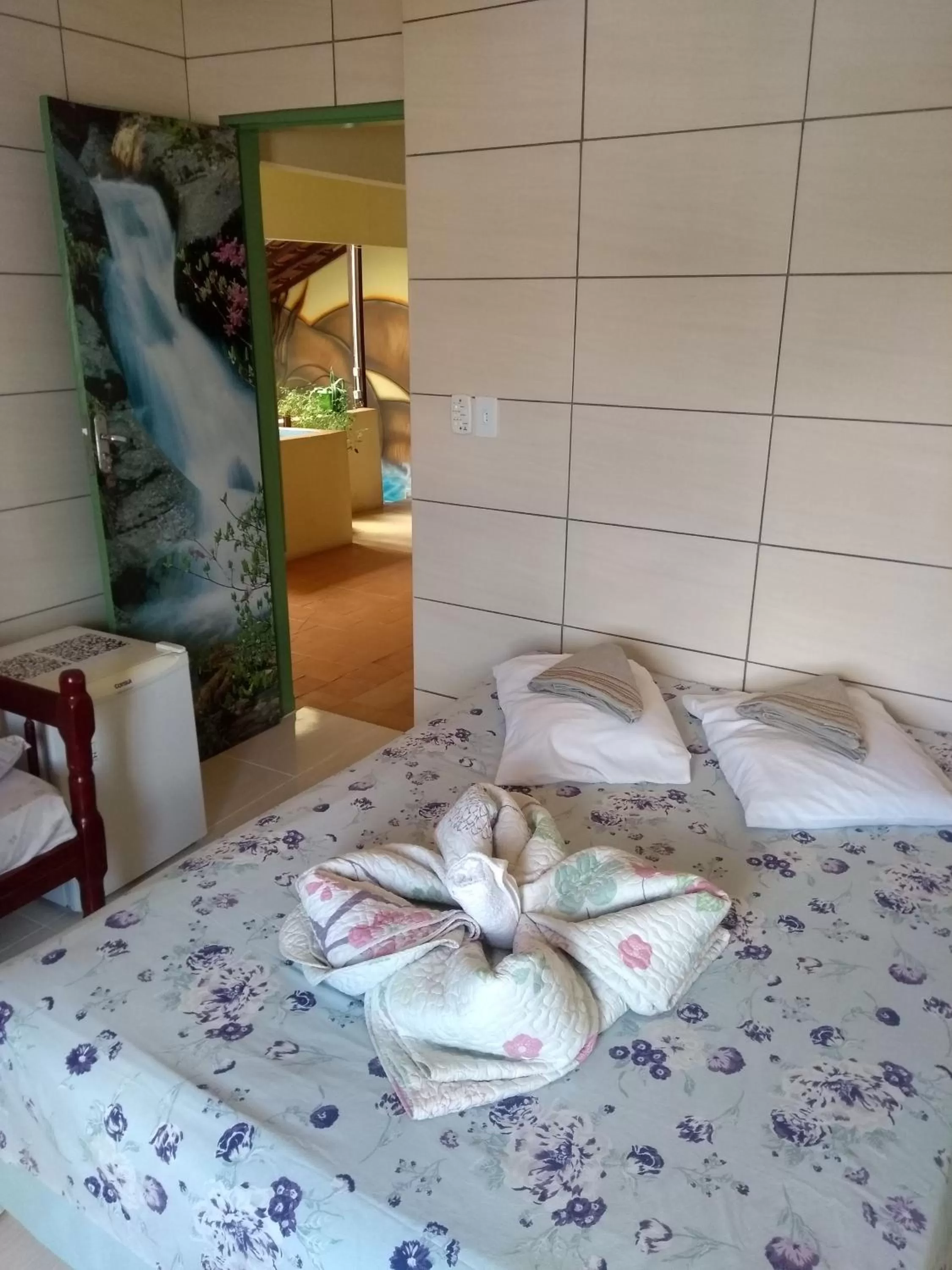 Property building, Bed in Pousada Encanto e Magia