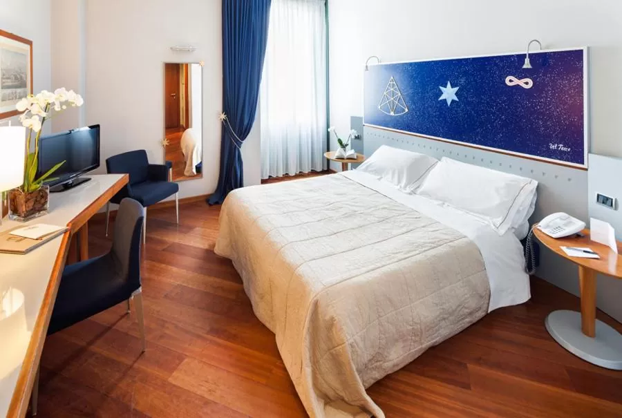 Bed in Cosmo Hotel Torri