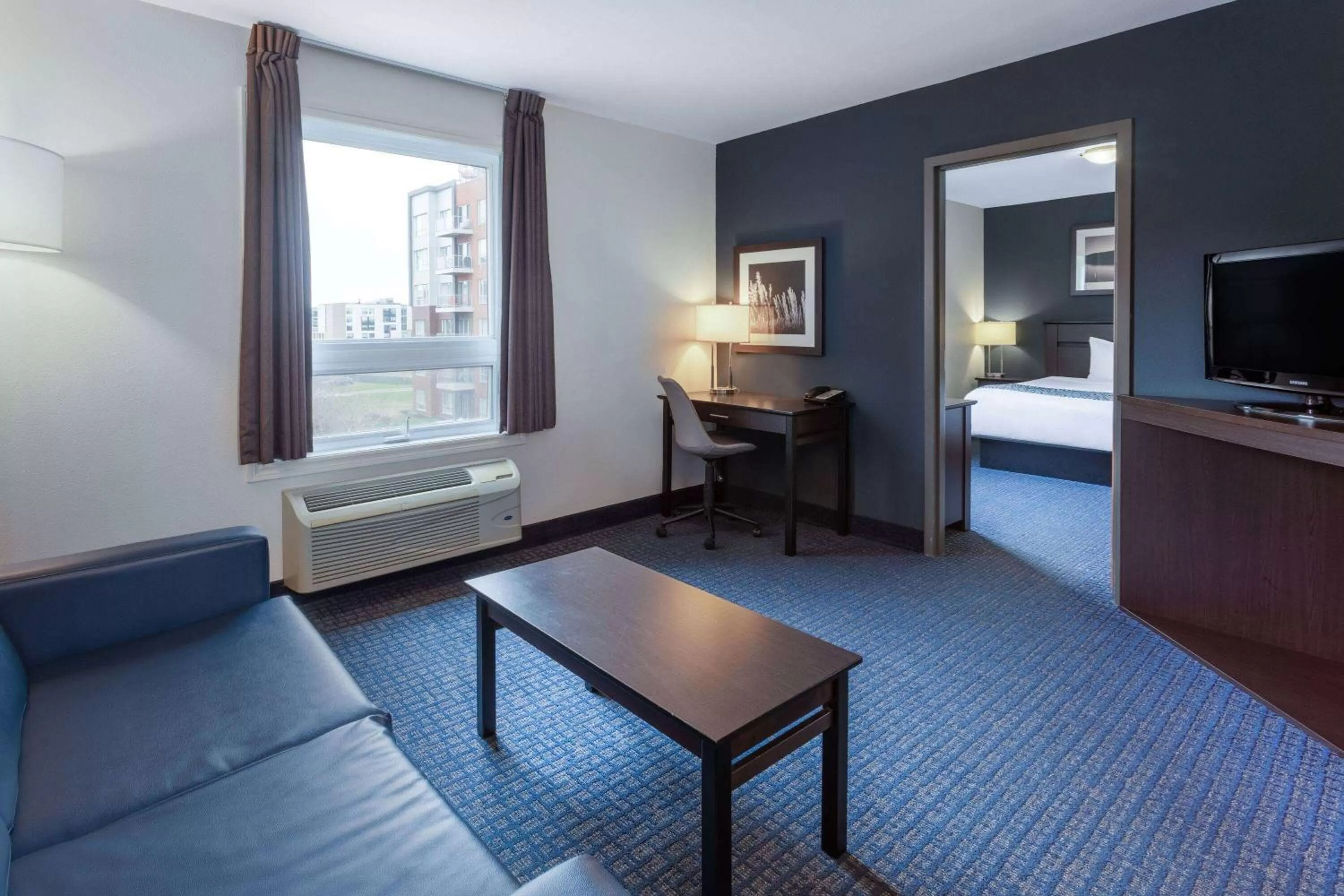 Bed in Super 8 by Wyndham Lachenaie/Terrebonne