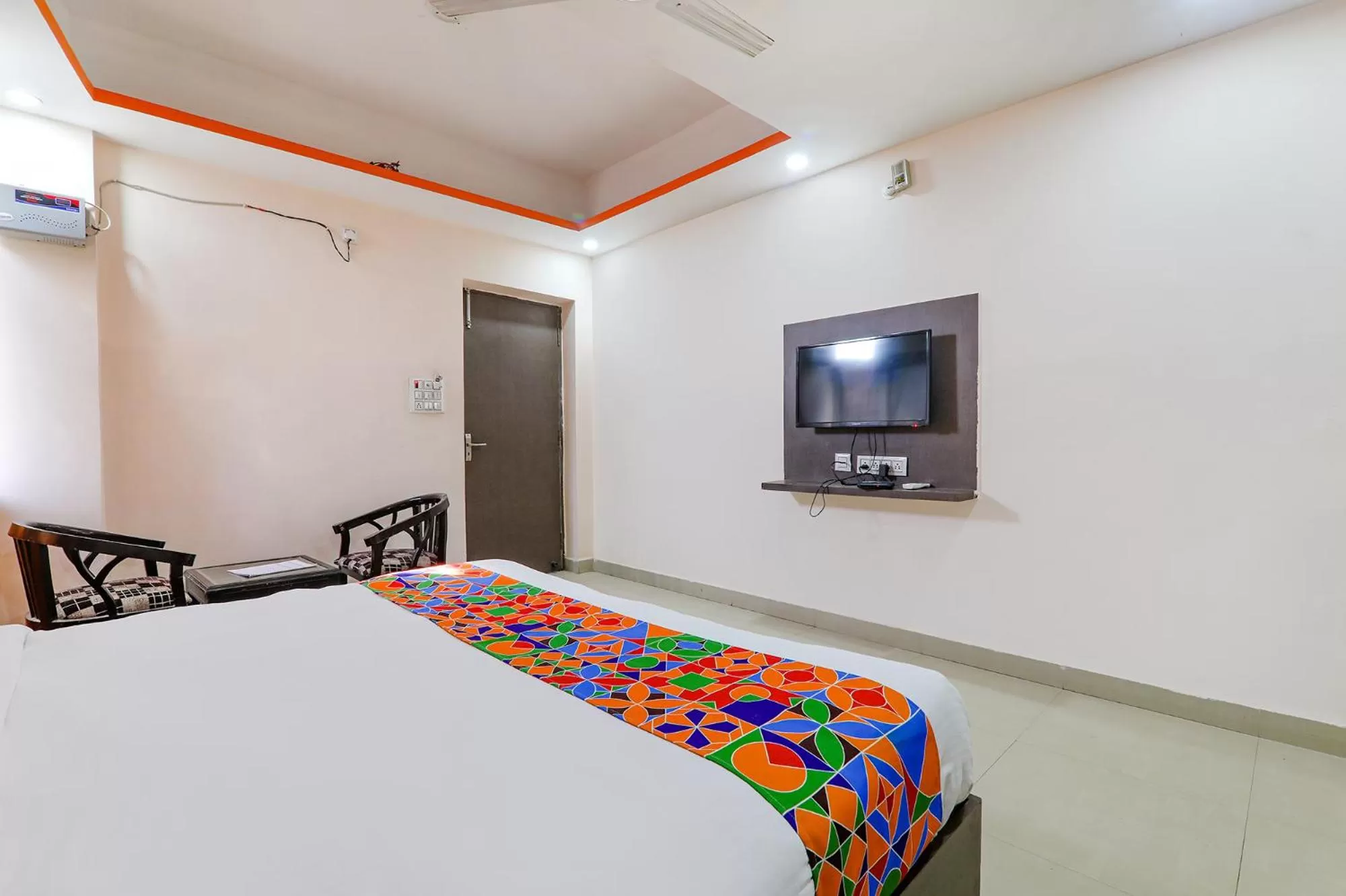 Bed in FabHotel Vinayaka