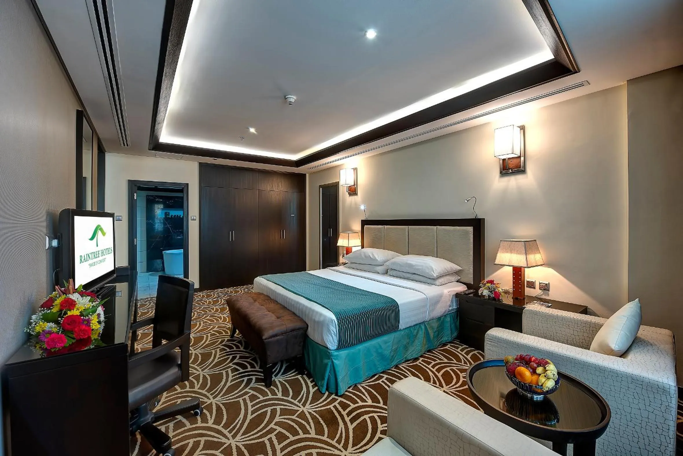 Bed in Raintree Rolla Hotel