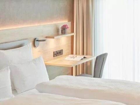 Bed in Gästehaus Bauer - Schlafen auf dem Weingut