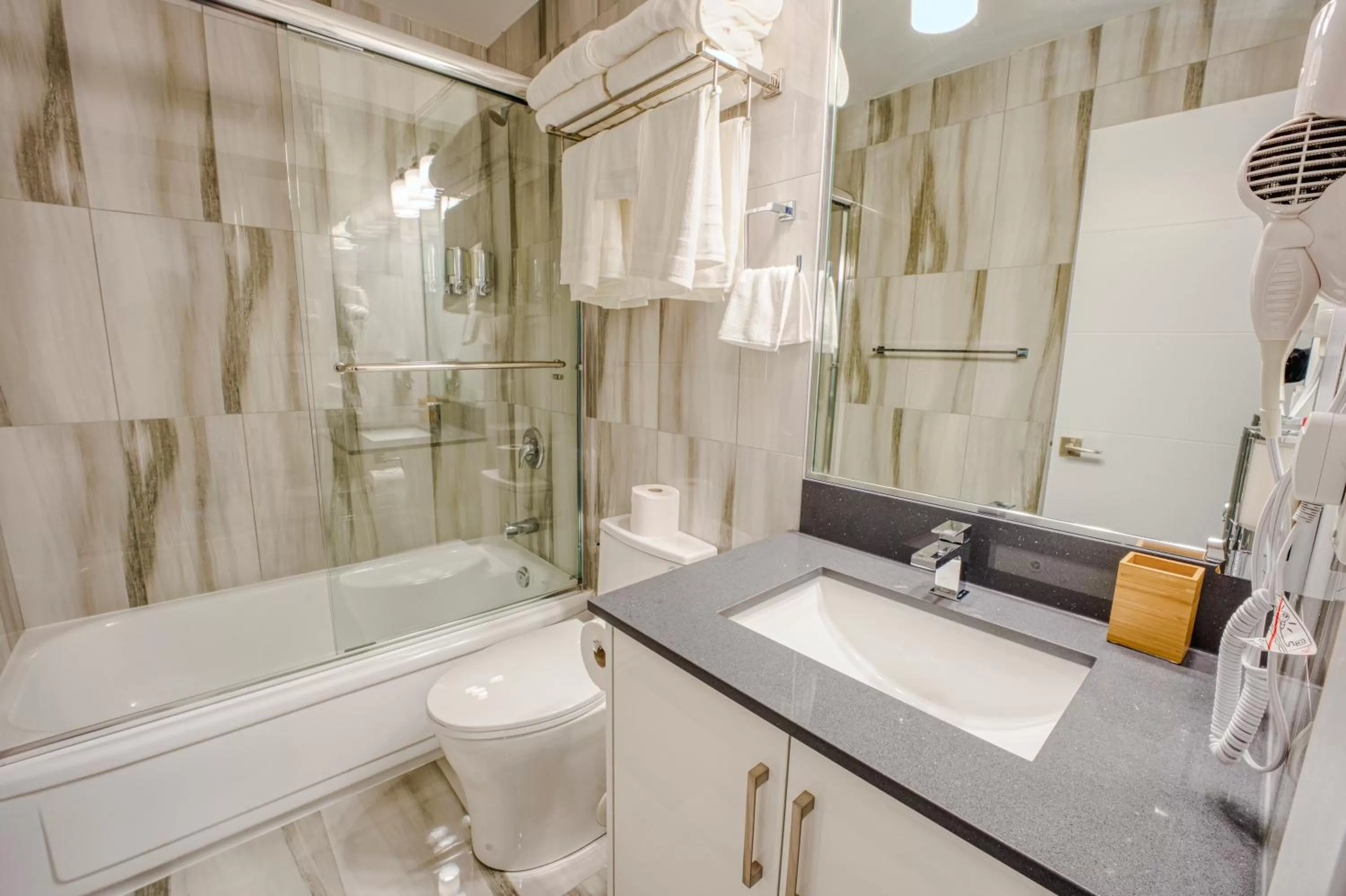 Toilet in Harrison Grand Motel