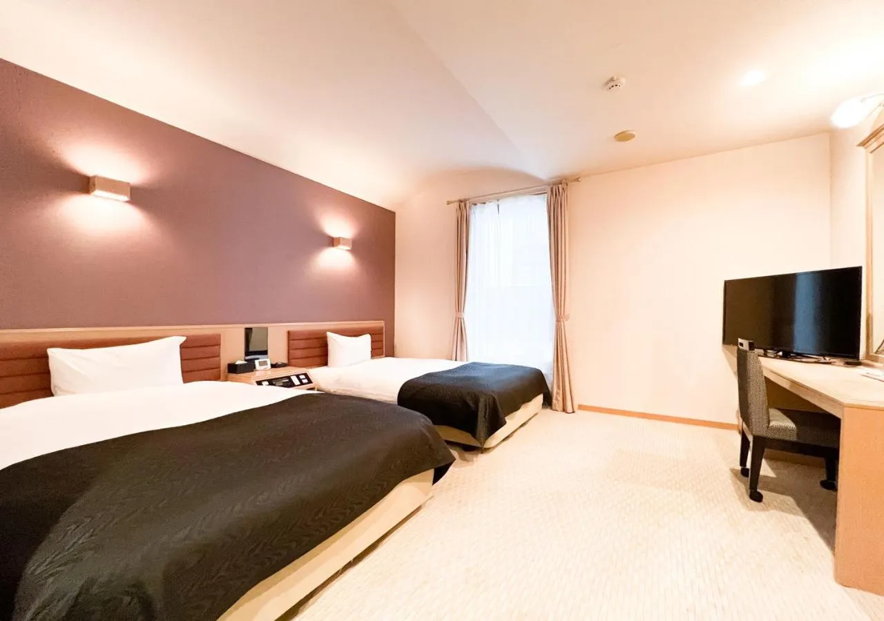 Photo of the whole room, Bed in APA Hotel TKP Sapporo Eki-Kitaguchi Excellent