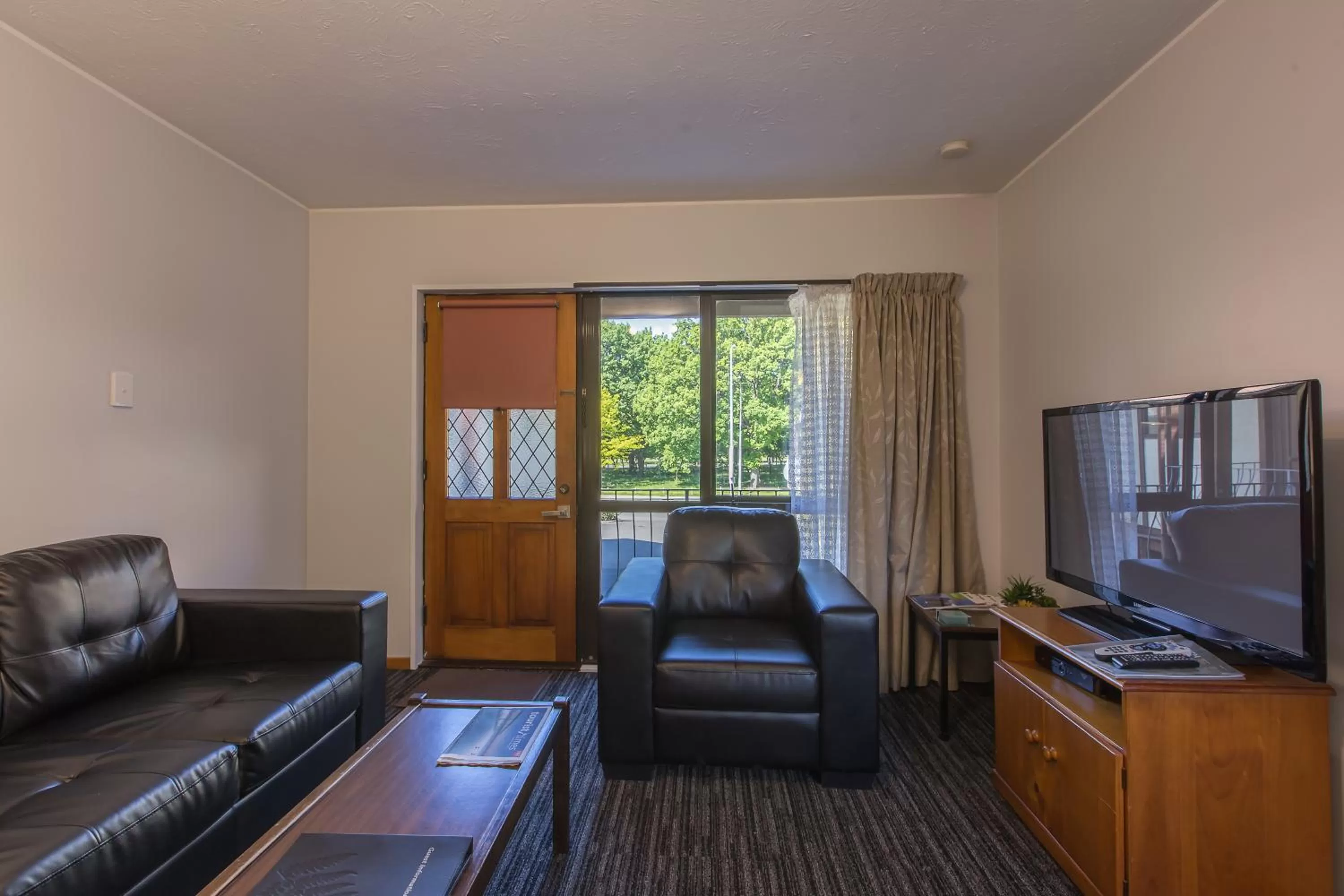 Living room in Argyle On The Park - Central Christchurch Motel Overlooking Hagley Park