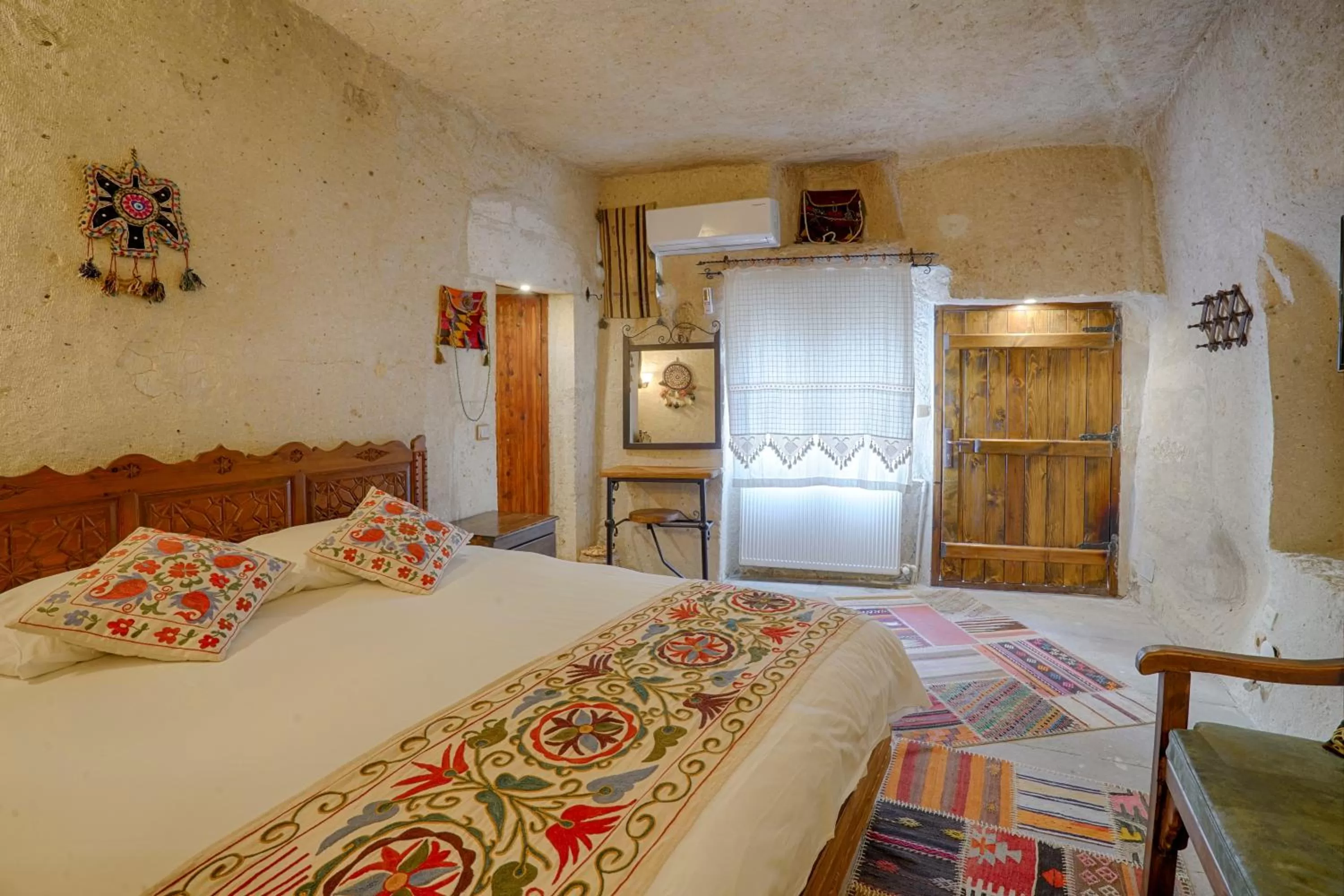 Bed in Tulip Cave Suites