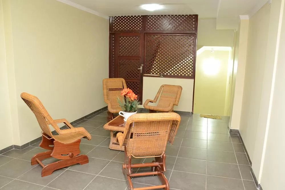 Communal lounge/ TV room in Requinte Hotel