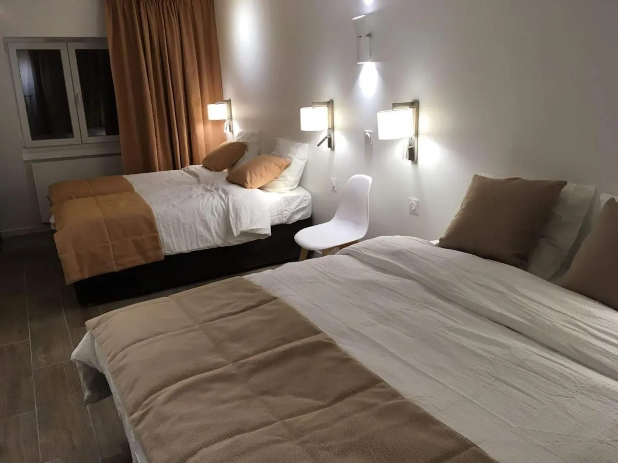 Bed in Hotel Ferney République