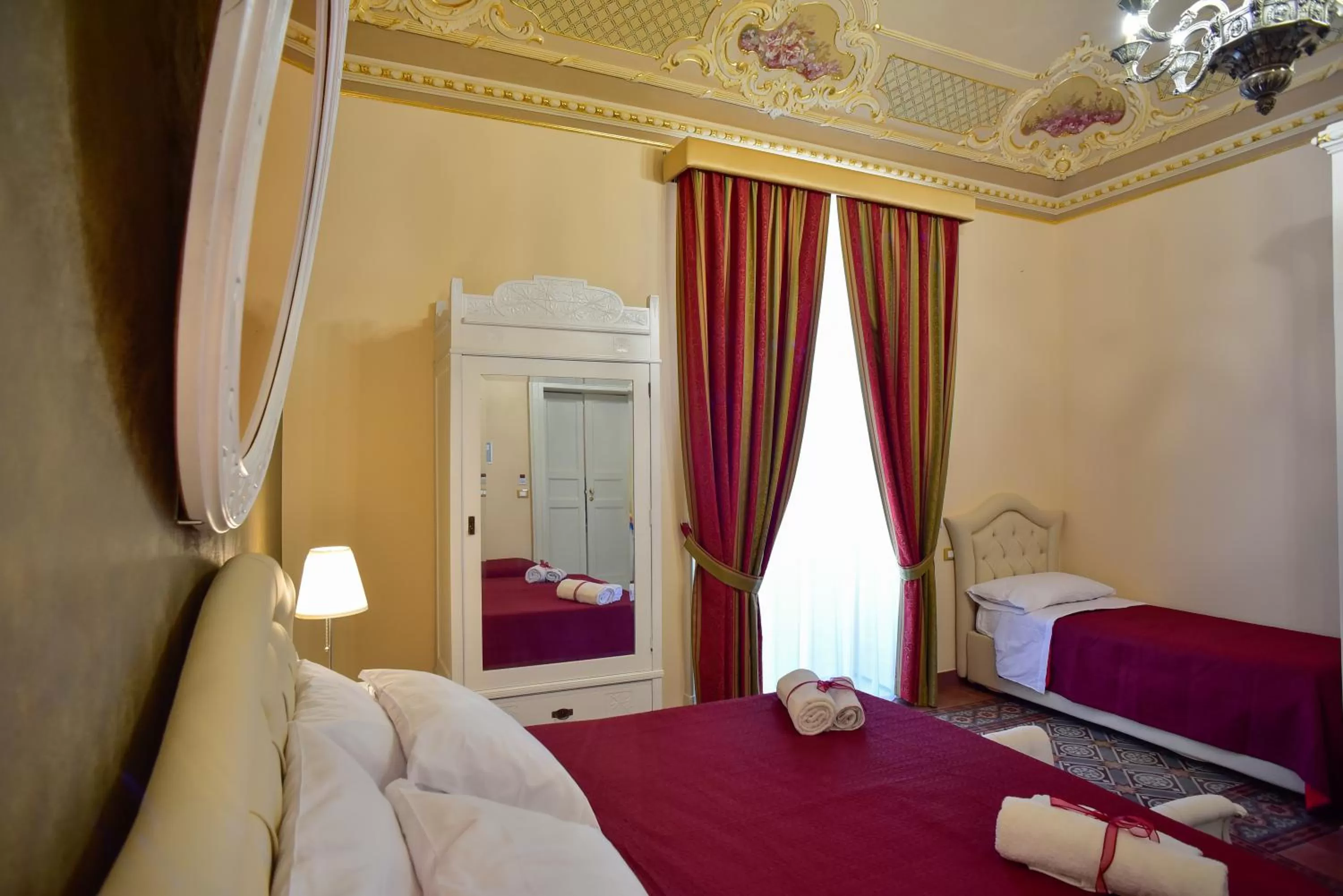 Photo of the whole room, Bed in Palazzo degli Affreschi