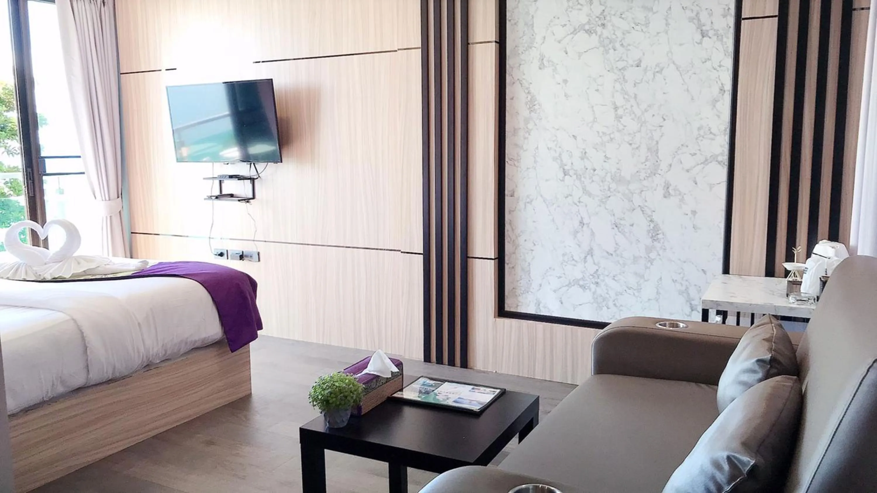 Seating area, Bed in Cliff Lanta Suite-Koh Lanta Krabi