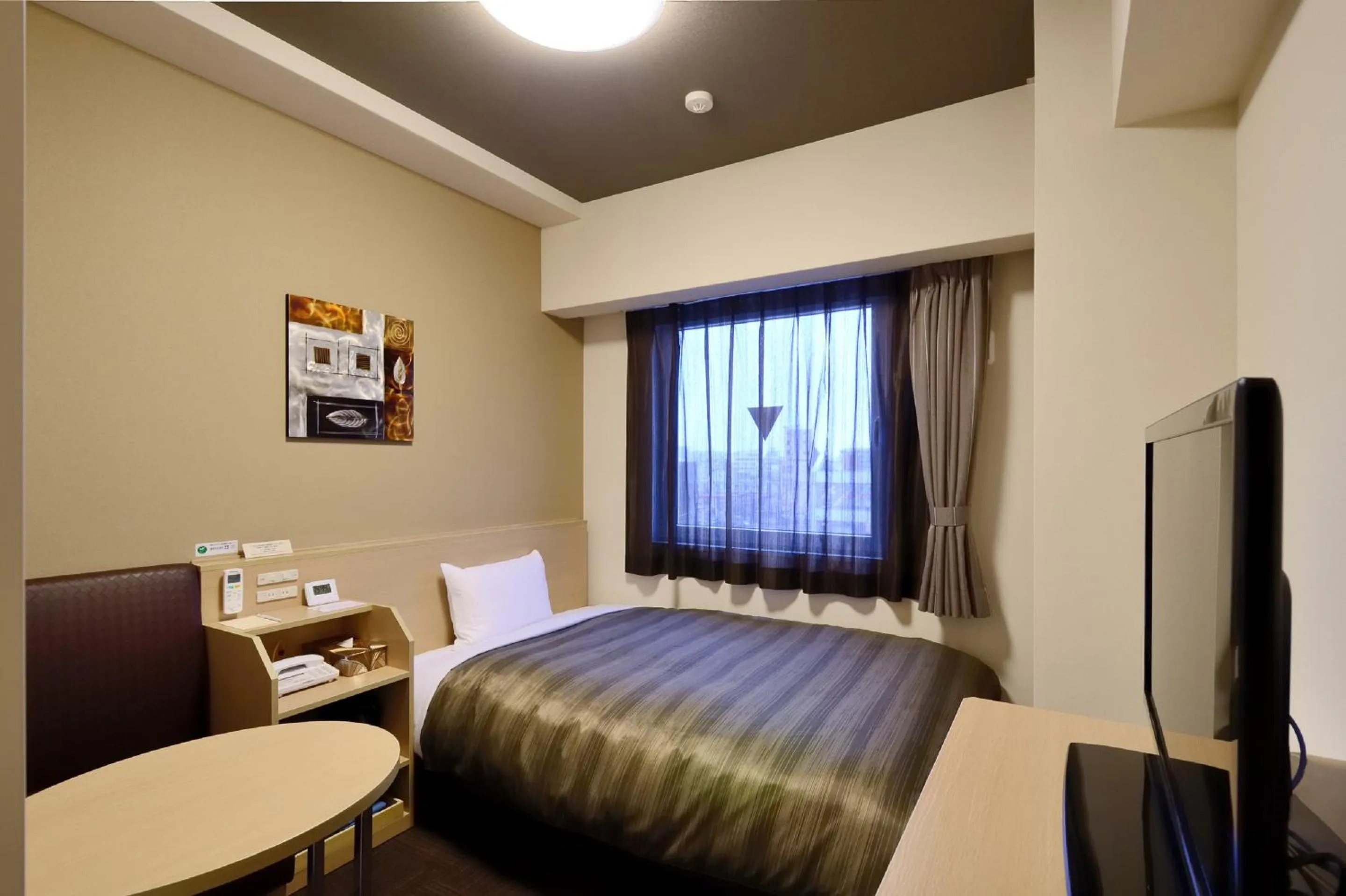Bed in Hotel Route-Inn Sendai Higashi