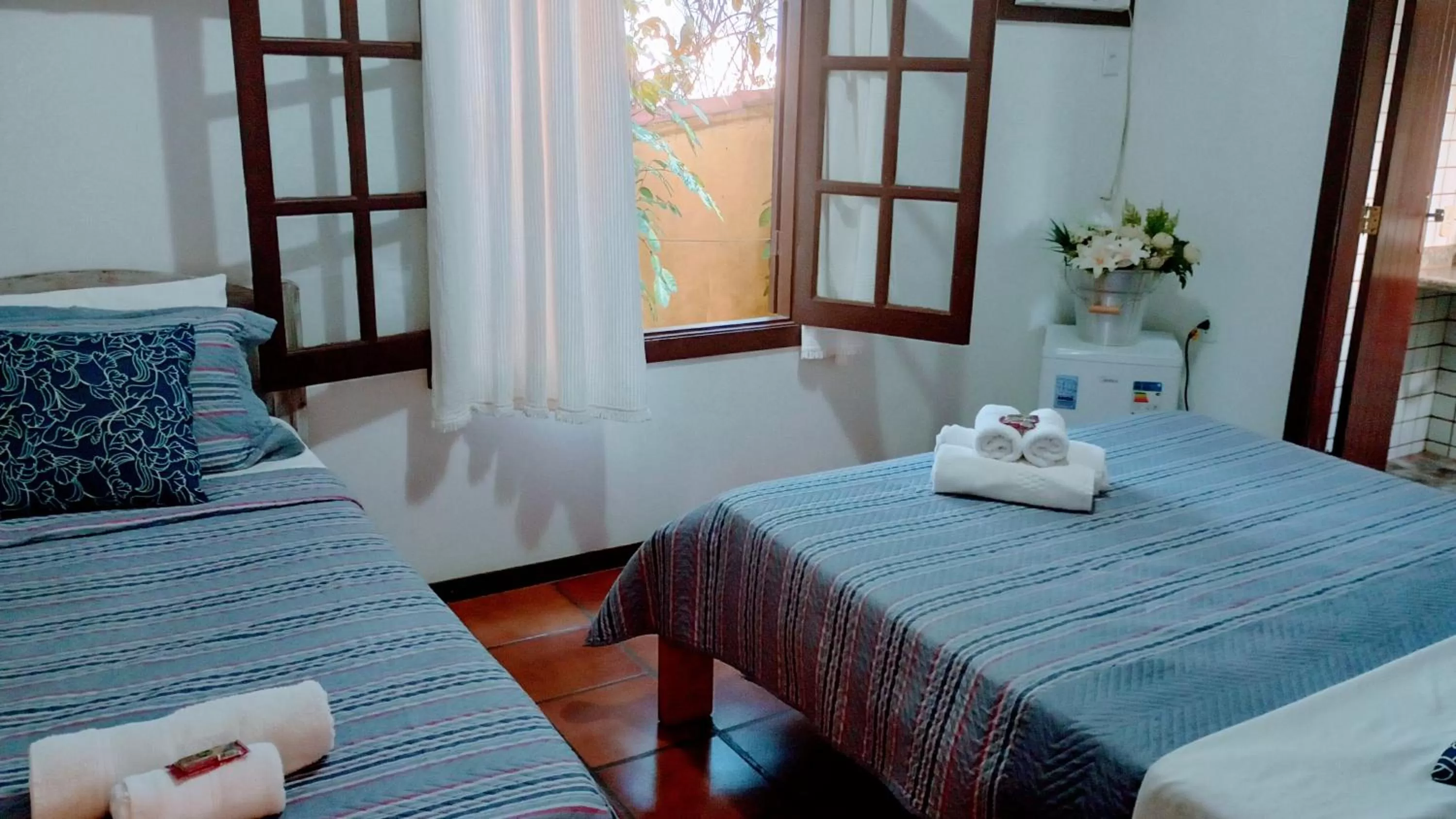 Bed in Hibiscos Pousada