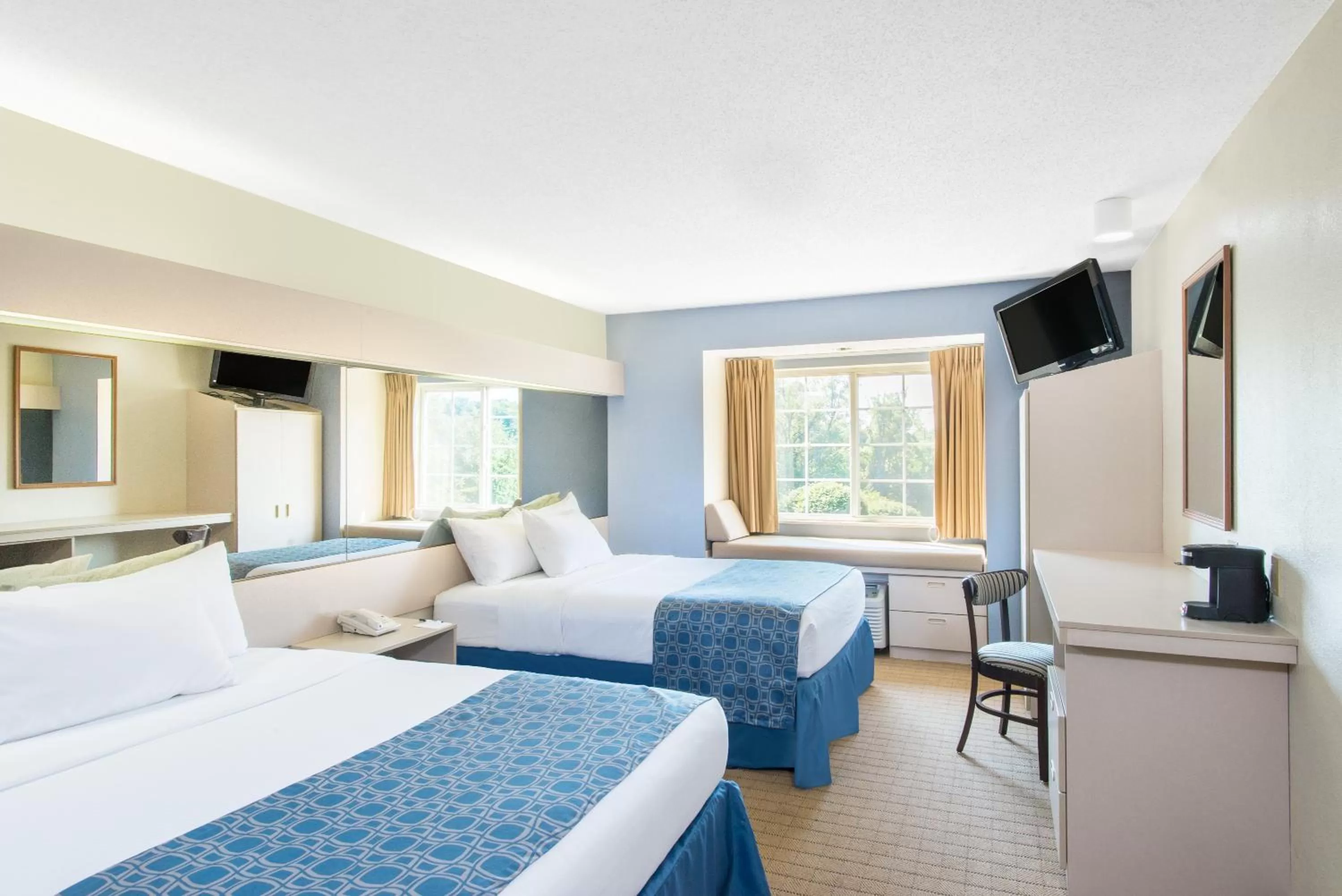 Bed in Microtel Inn & Suites by Wyndham