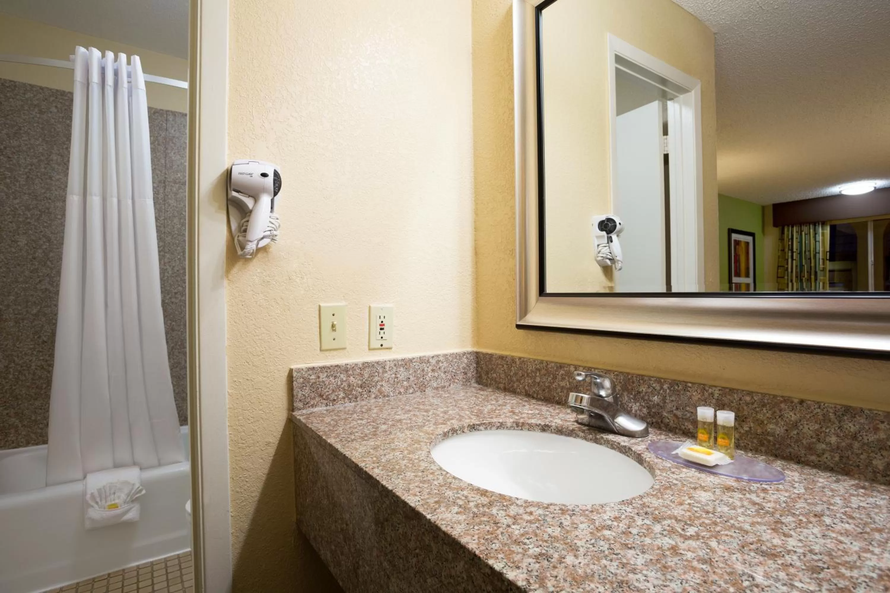 Bathroom in Days Inn by Wyndham Dallas Irving