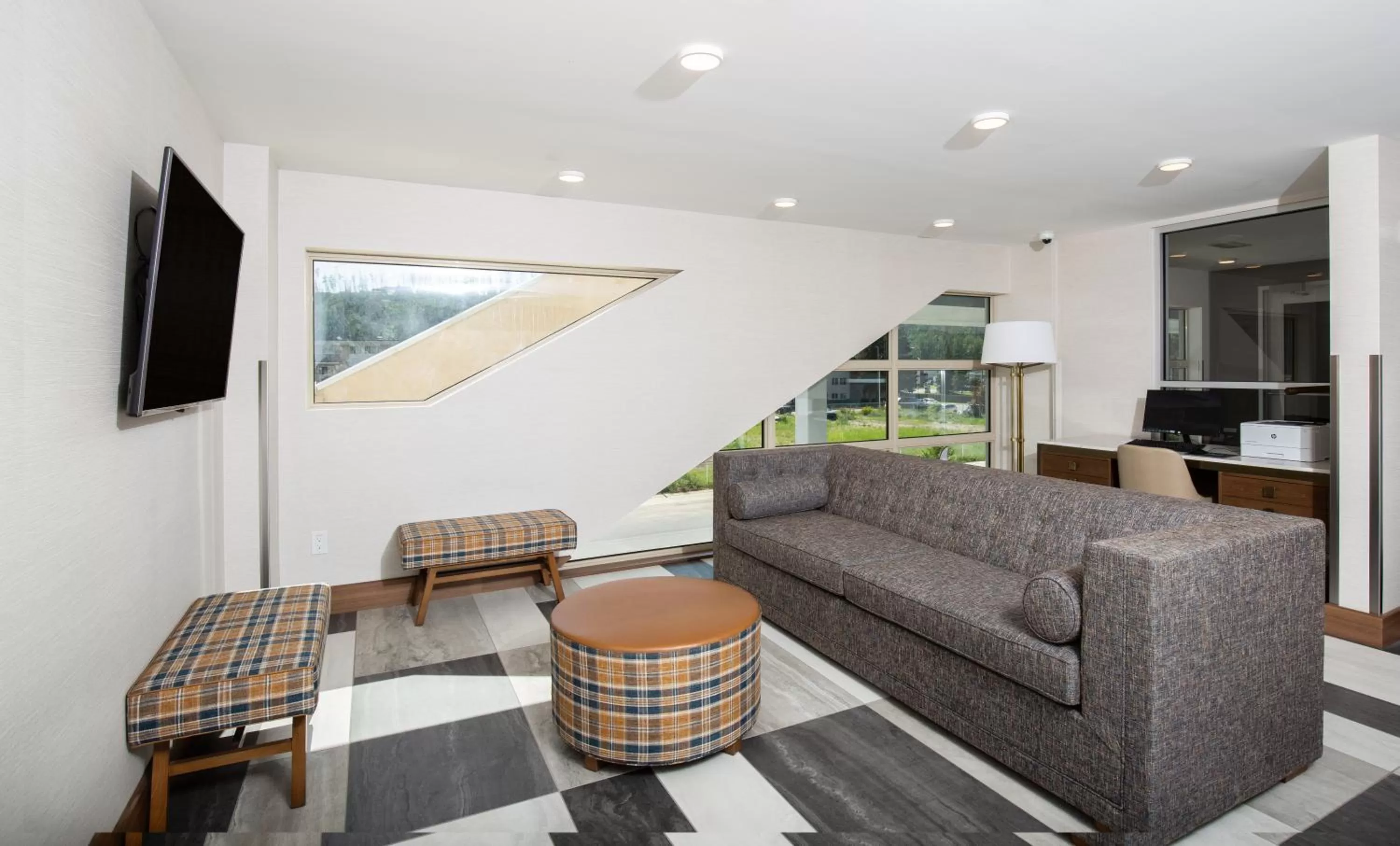 Communal lounge/ TV room in Pomeroy Hotel Fort McMurray