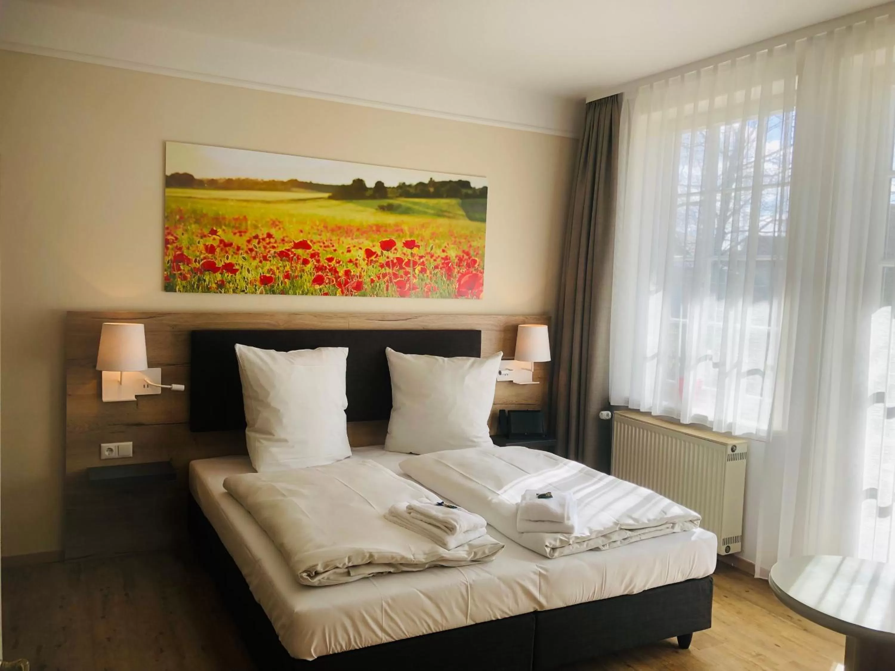 Photo of the whole room, Bed in Landhotel Gutshof im Oertzetal in Oldendorf, Südheide