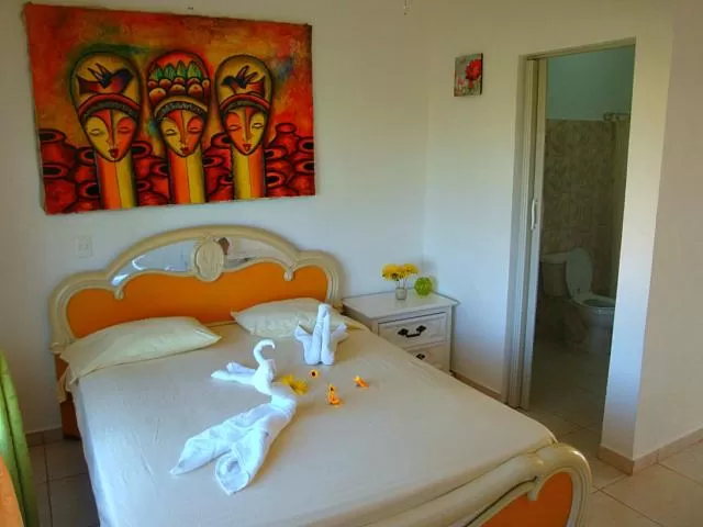 Bed in El Malecon B&B Hotel