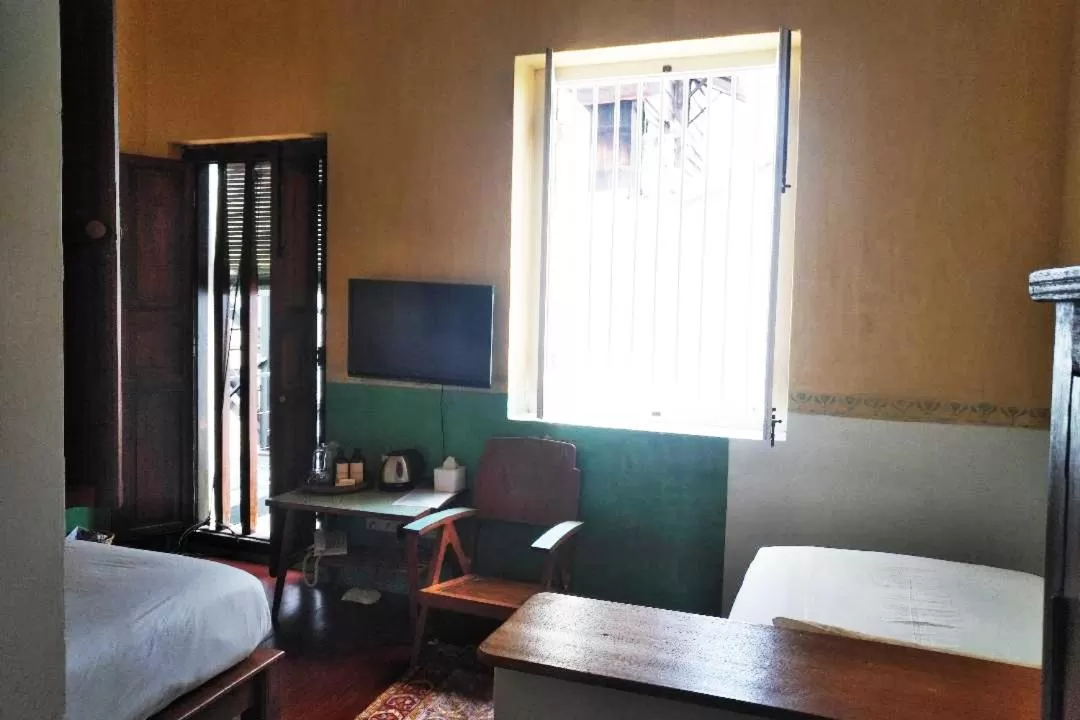 Bed in Ren I Tang Heritage Inn