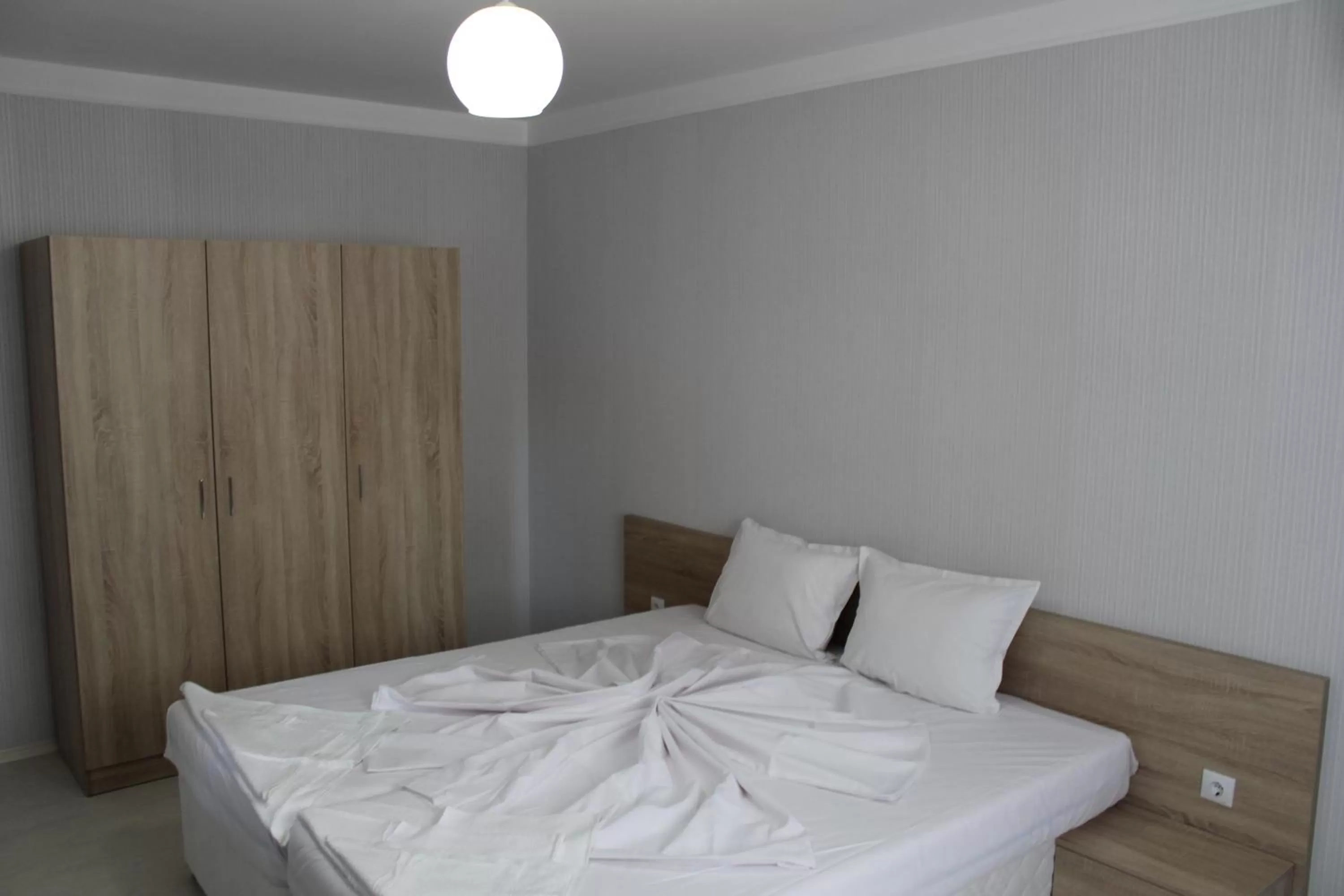 Bed in APART-HOTEL Stamopolu Lux с изглед към морето