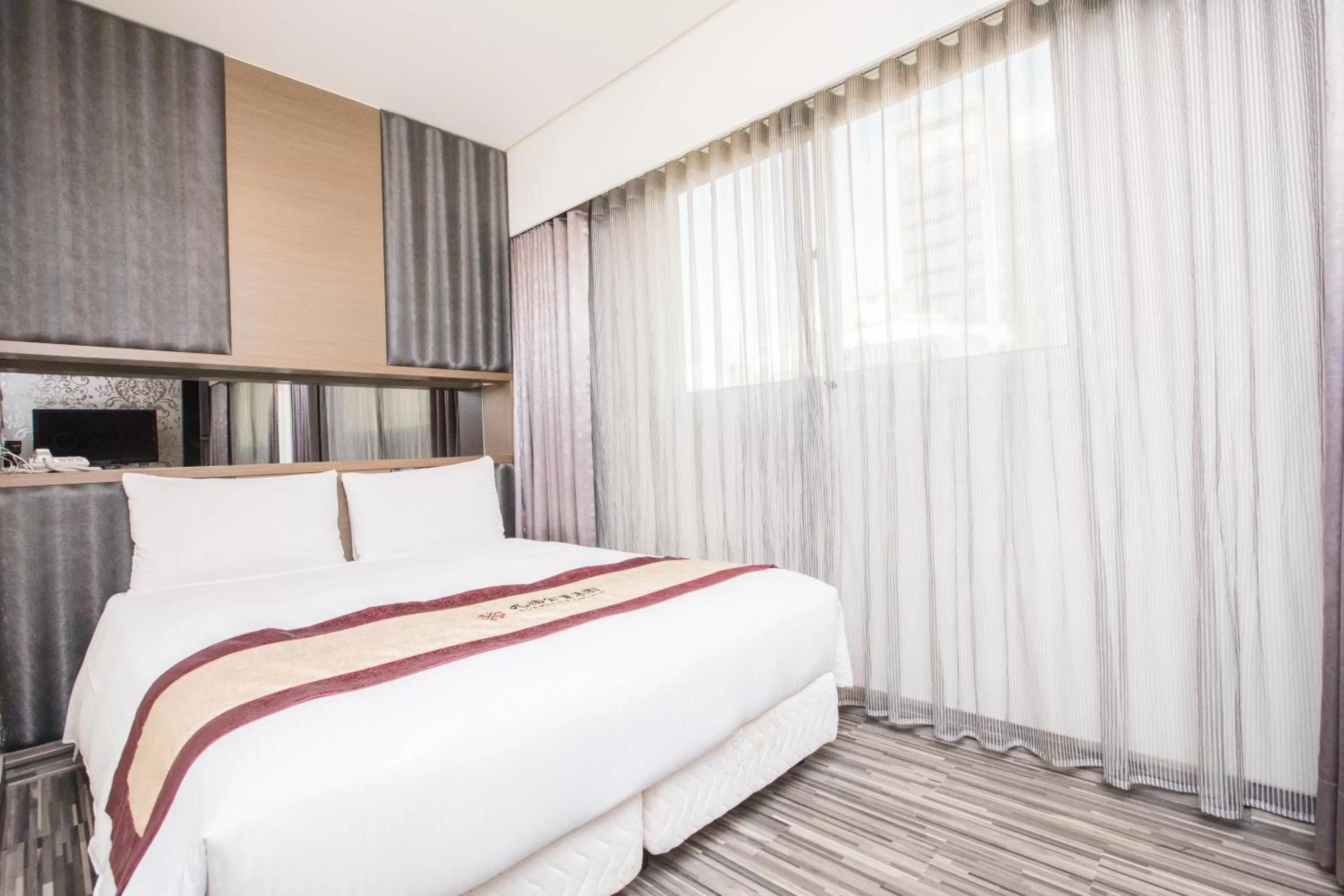 Bed in Harmonious Hotel