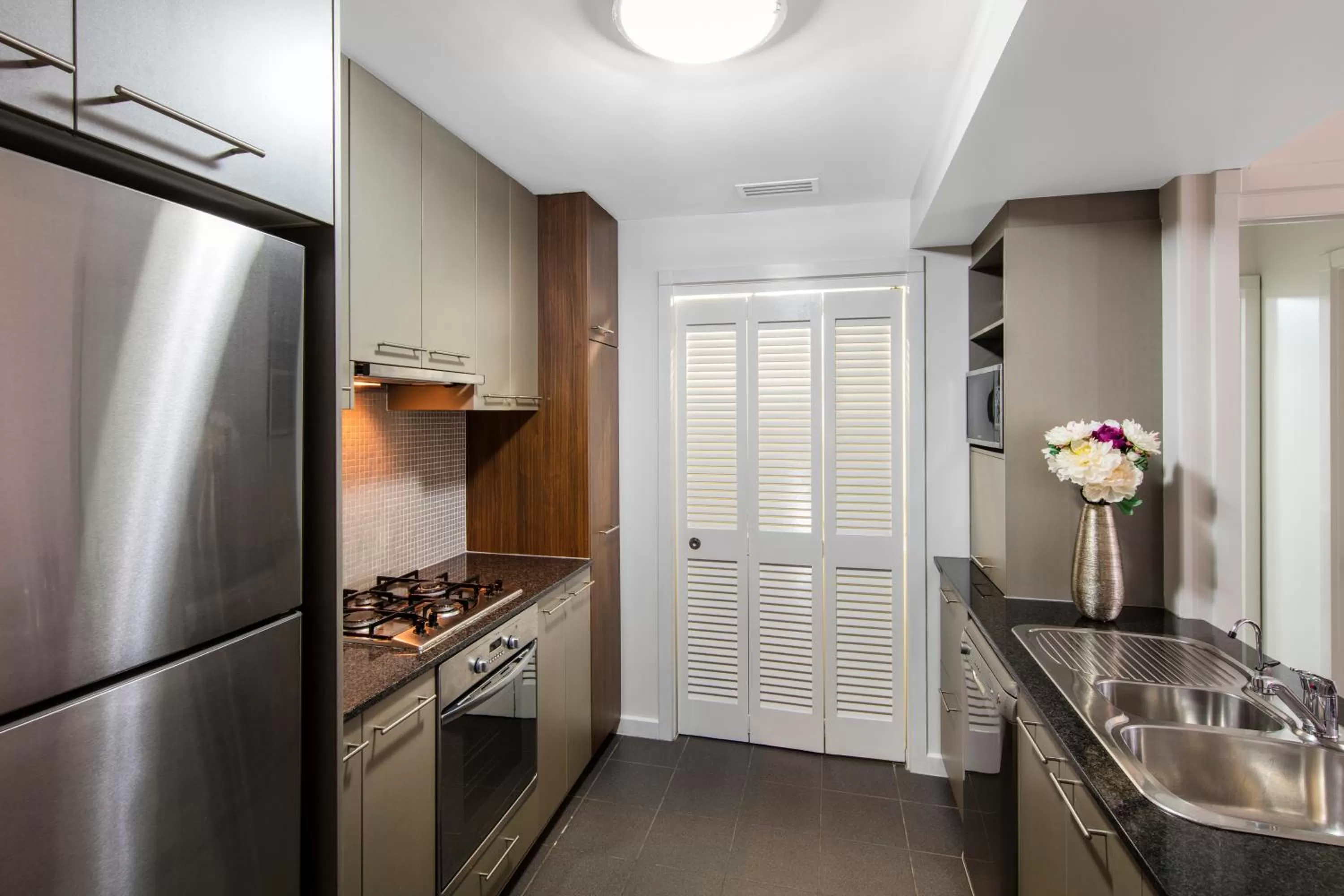 Kitchen or kitchenette in Oaks Brisbane Mews Suites