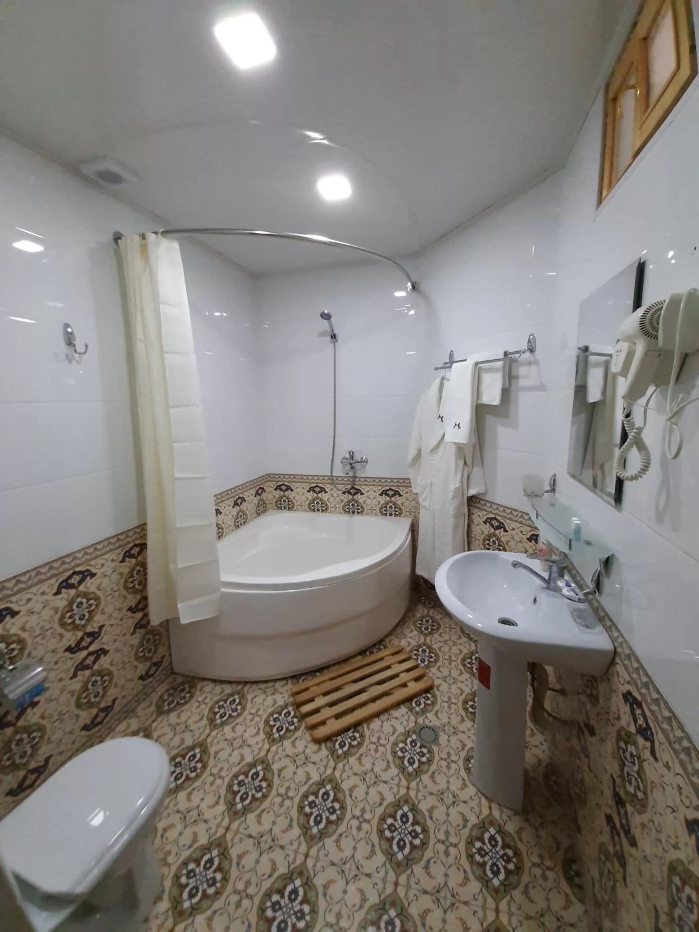 Shower in madrasah Polvon-Qori boutique hotel XIX century