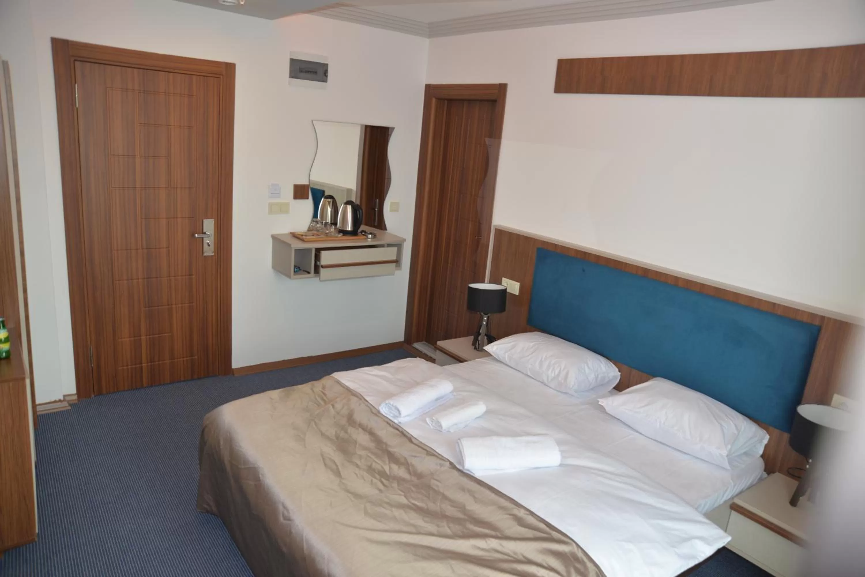 Bed in TEVETOGLU HOTEL