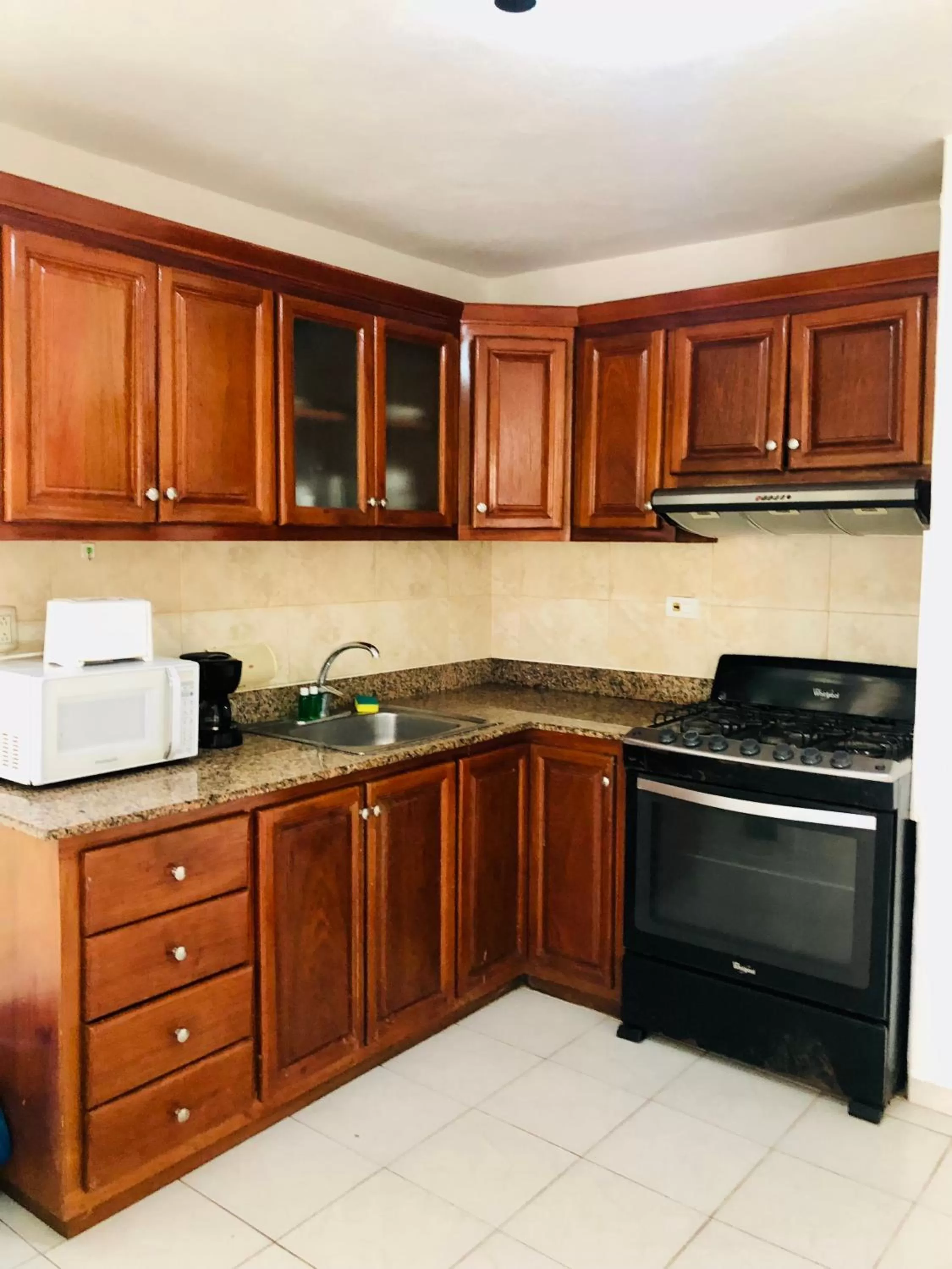 Kitchen/Kitchenette in Los Corales Luxury Villas Beach Club and Spa