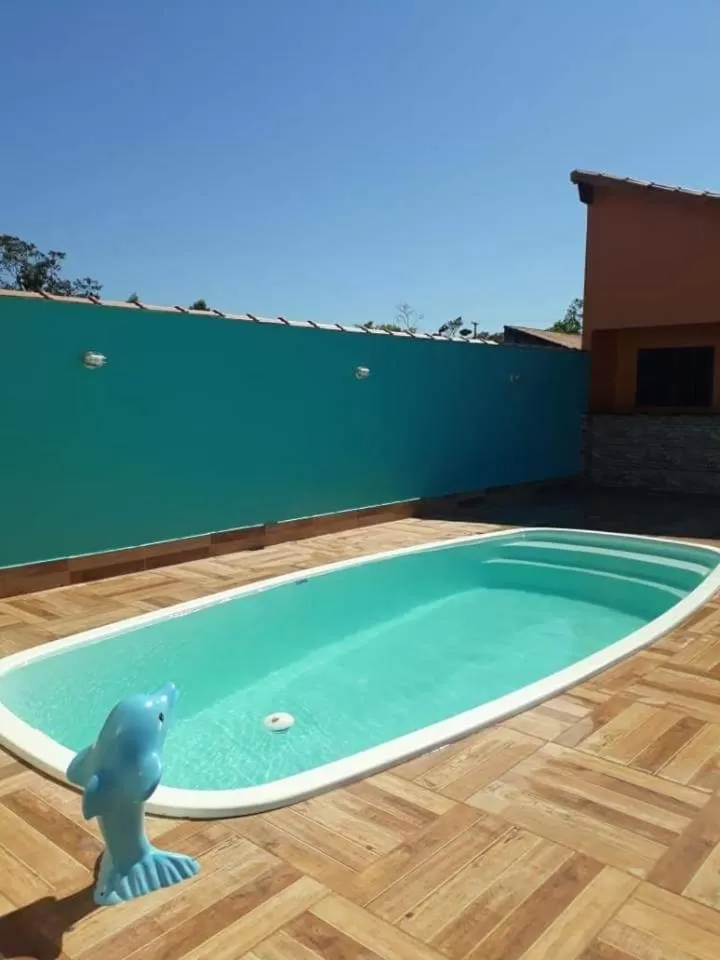 Swimming pool in Suítes Baía do Sol Saquarema