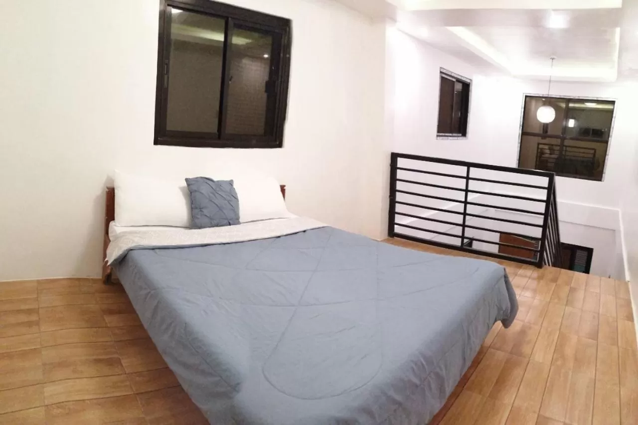 Bed in Purple Orchid Bed and Breakfast