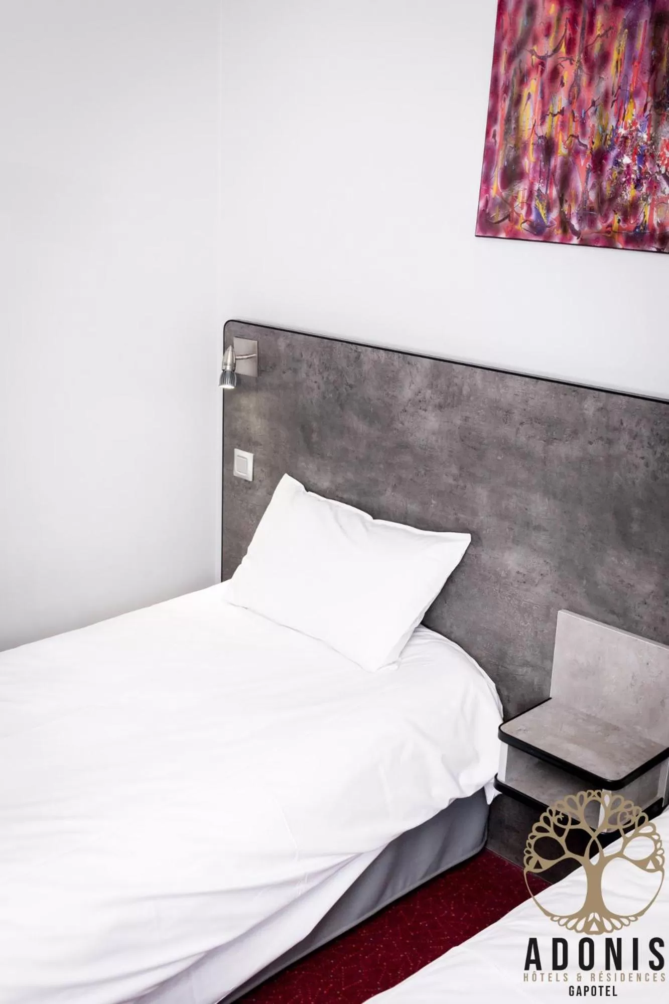 Bed in Adonis Gapotel