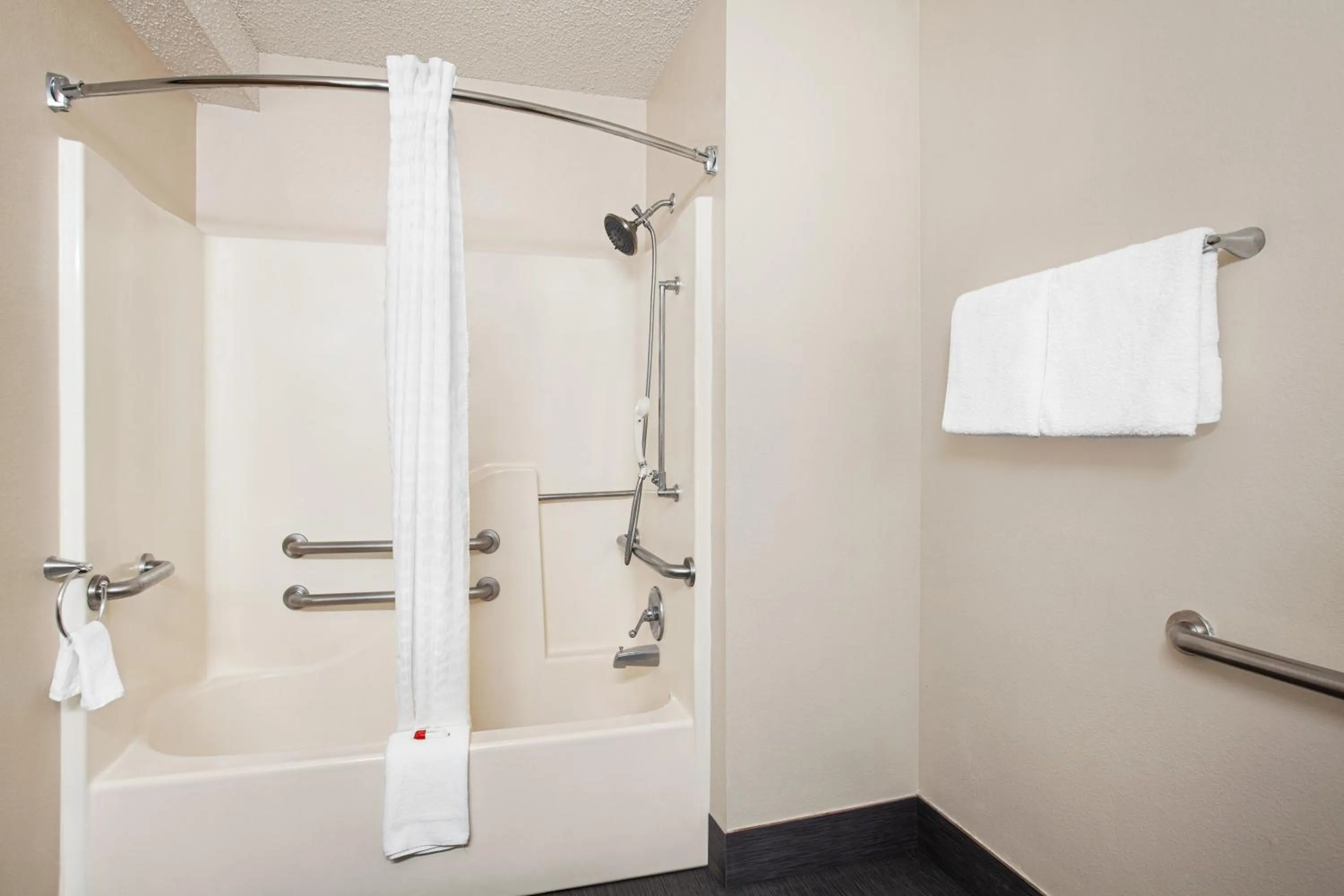 Shower in Days Inn by Wyndham Kansas City International Airport