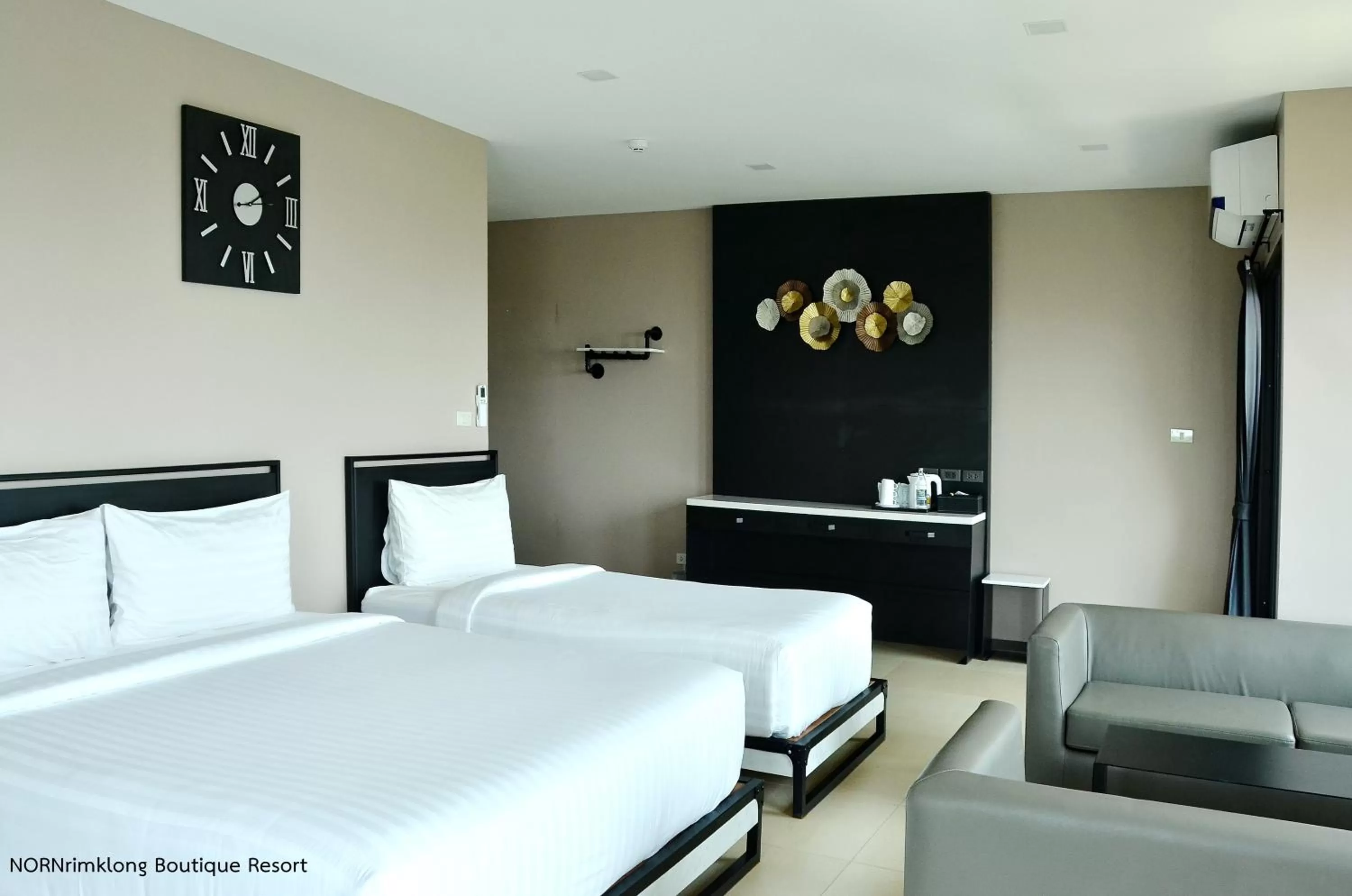 Bed in NORN Rimklong Bangkok Hotel