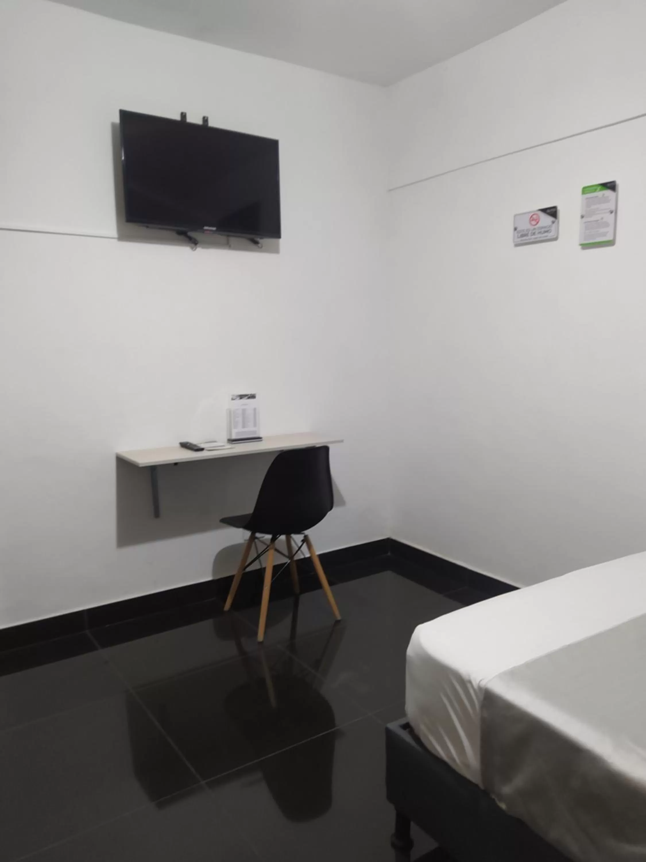 TV and multimedia, TV/Entertainment Center in Hotel Aura Medellin