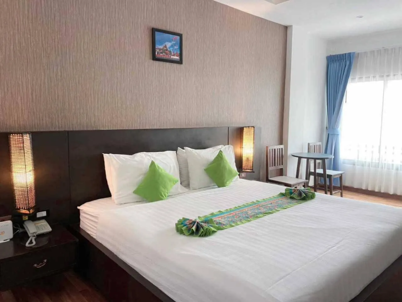 Bed in Jingjit Hotel