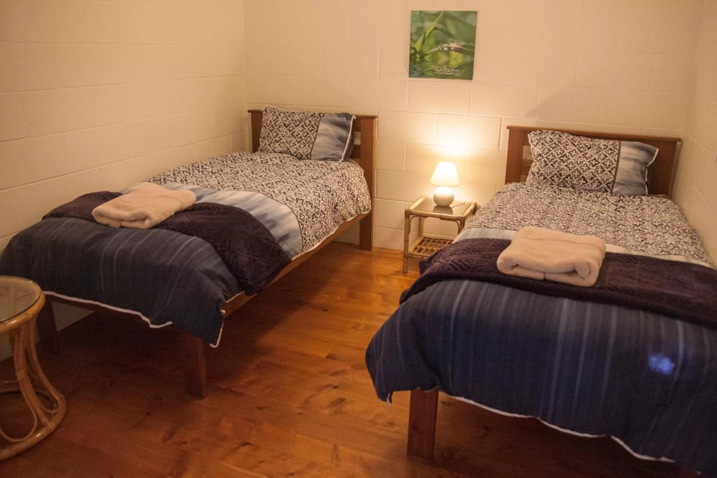 Bed in Kawai Purapura Yoga Retreat Centre