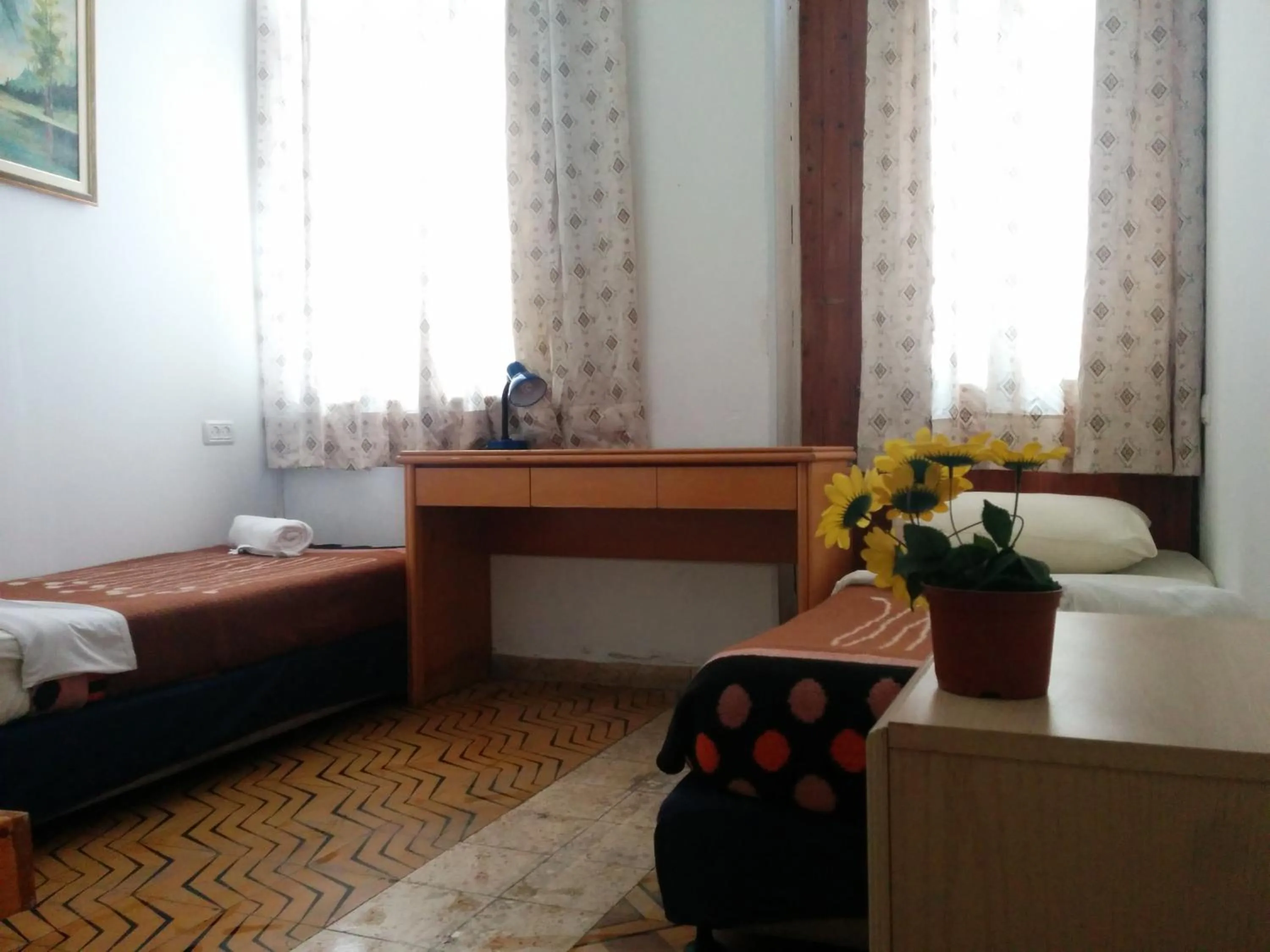 Bed, Seating Area in Momo's Hostel