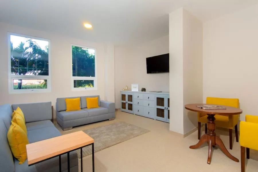 Communal lounge/ TV room in Hotel Xue Sabana