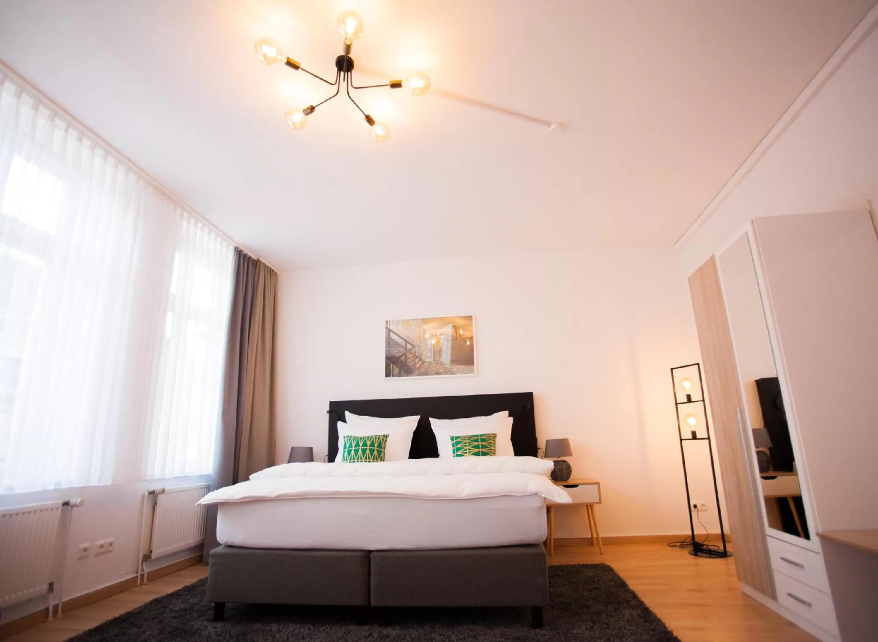 Bed in ONNO Boutique Hotel & Apartments