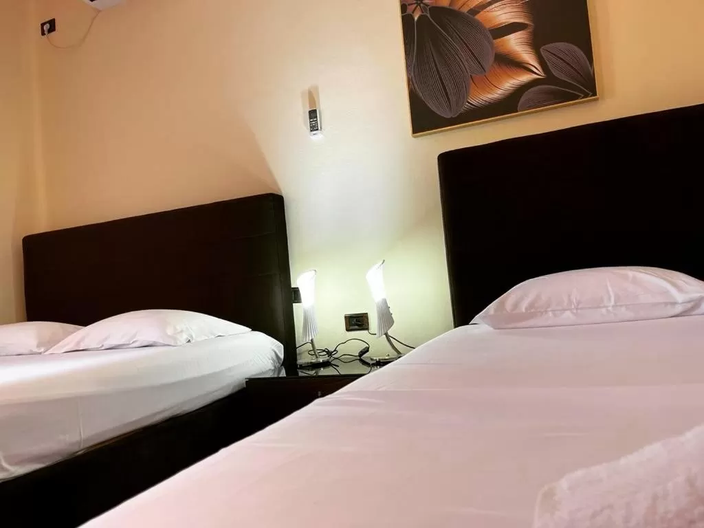 Bed in Hotel Ambasador