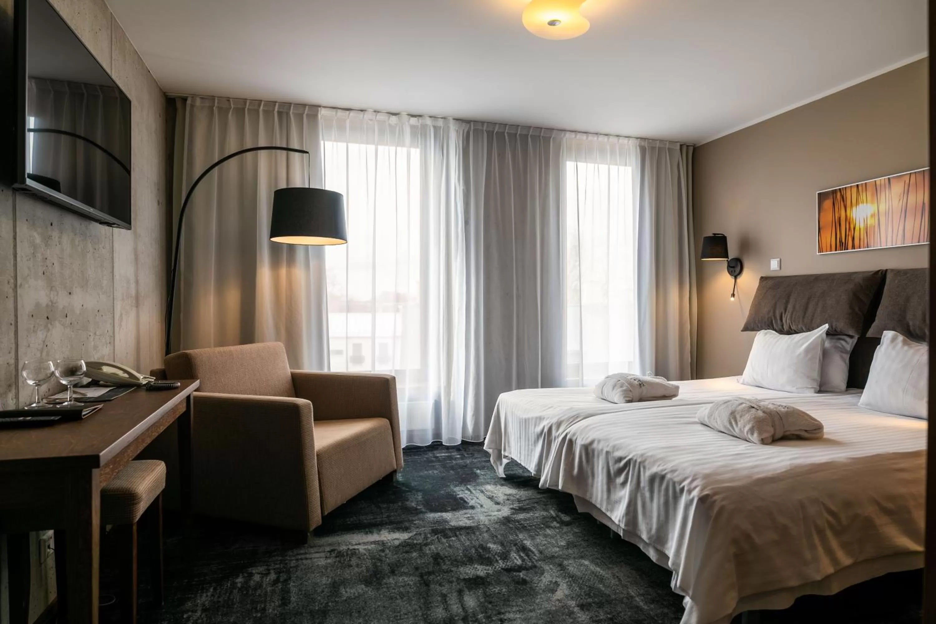 Bed in Johan Design & SPA Hotel