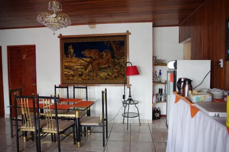 Communal lounge/ TV room, Restaurant/Places to Eat in Hotel Your House