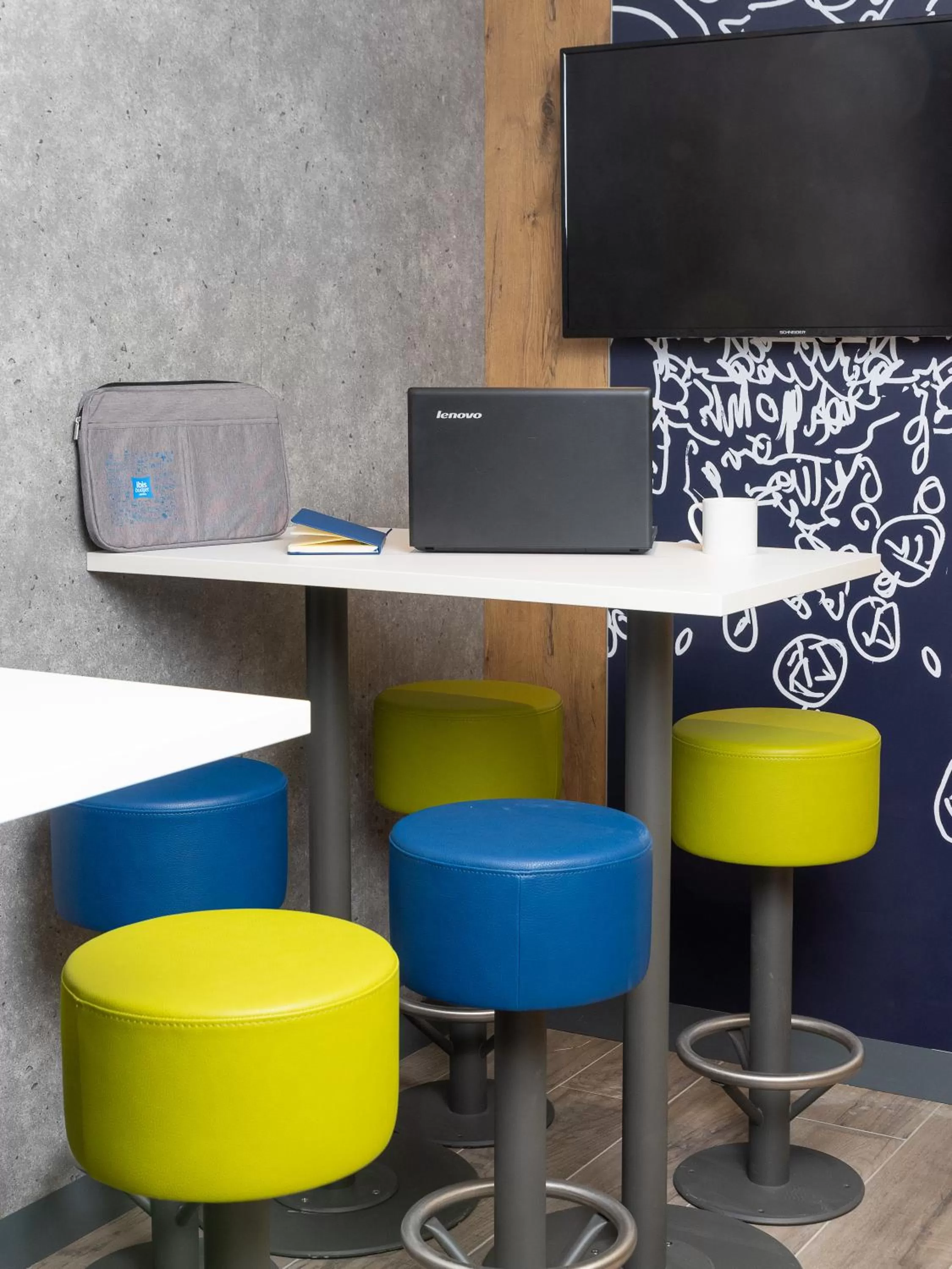 Communal lounge/ TV room in ibis Budget Cognac