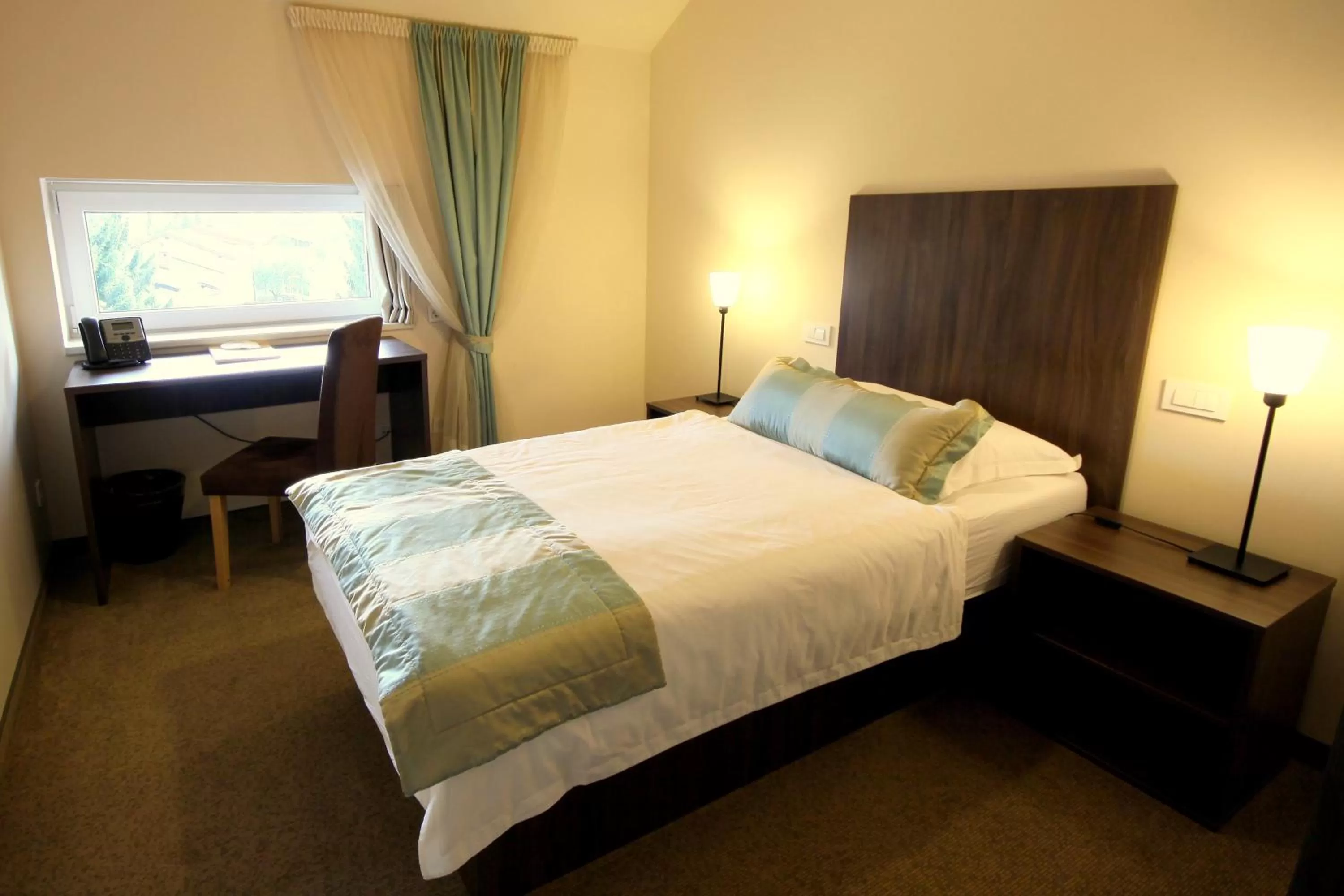 Bed in Ambient Hotel