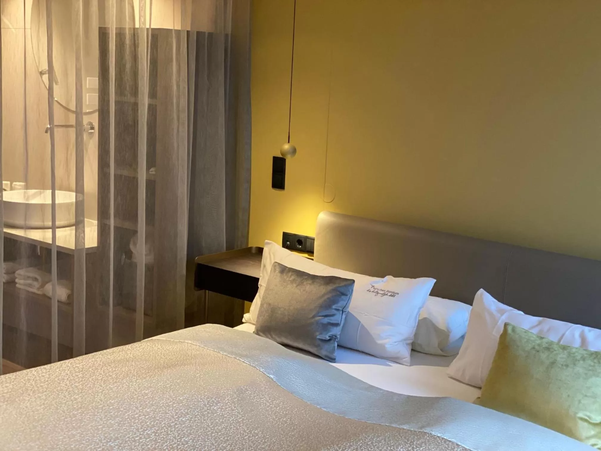 Bathroom, Bed in hirschen dornbirn - das boutiquestyle hotel - skyrelax & wellness im rooftop