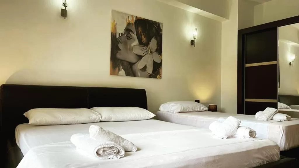 Bed in Hotel Ambasador