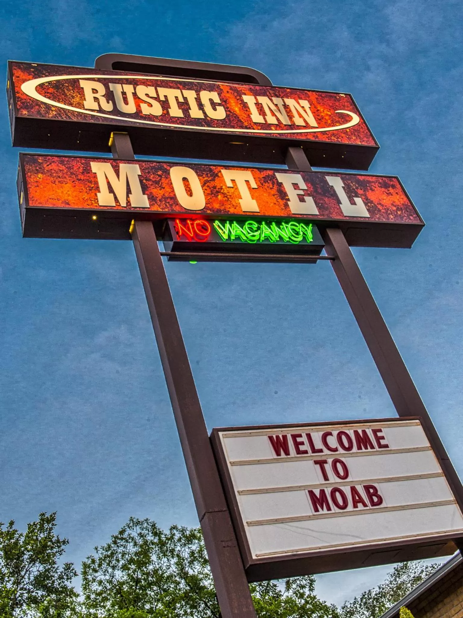 Property logo or sign in Rustic Inn