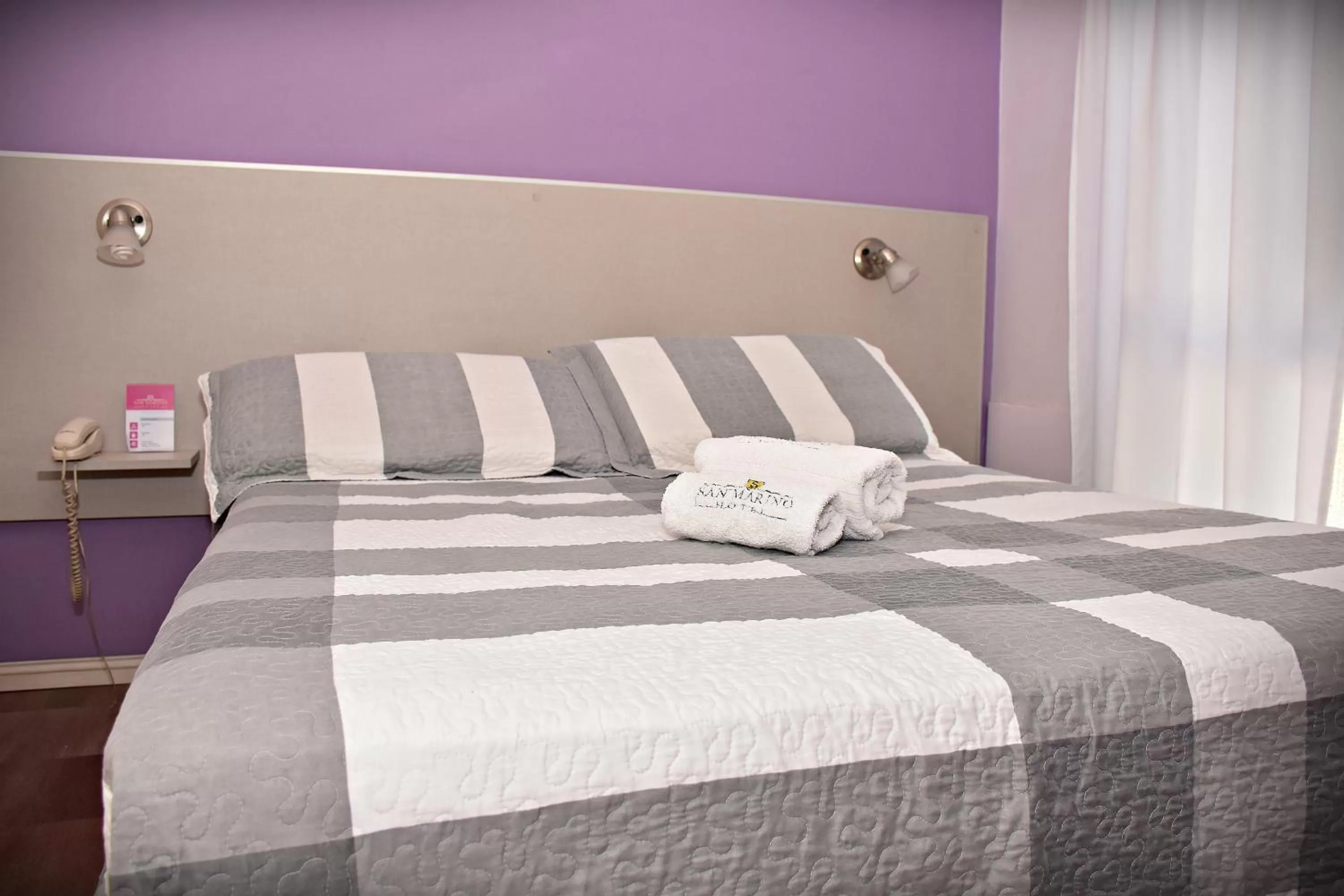 Bed in Hotel San Marino