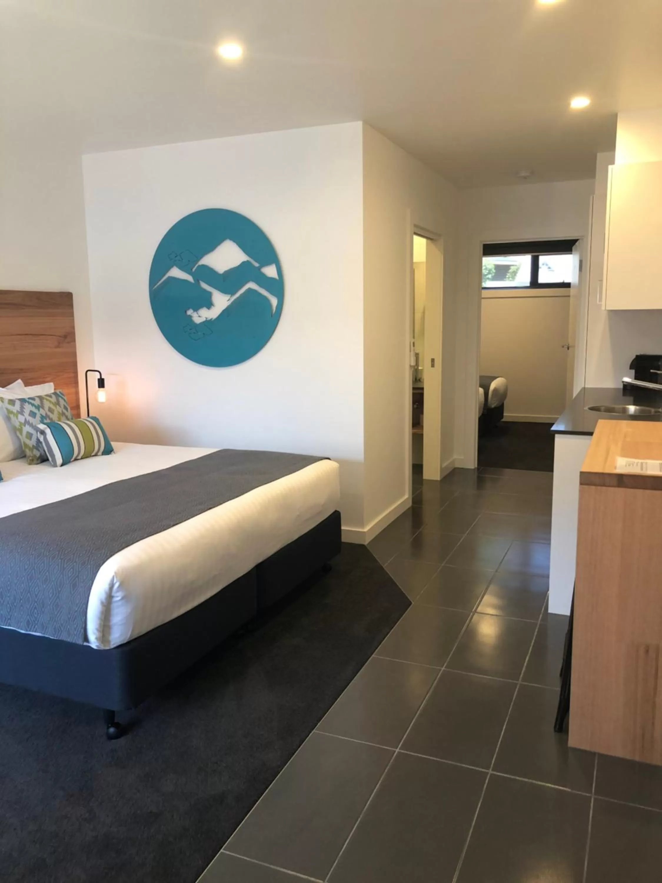 Bed in Bright Colonial Motel